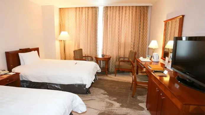 Bed in High1 Palace Hotel and CC