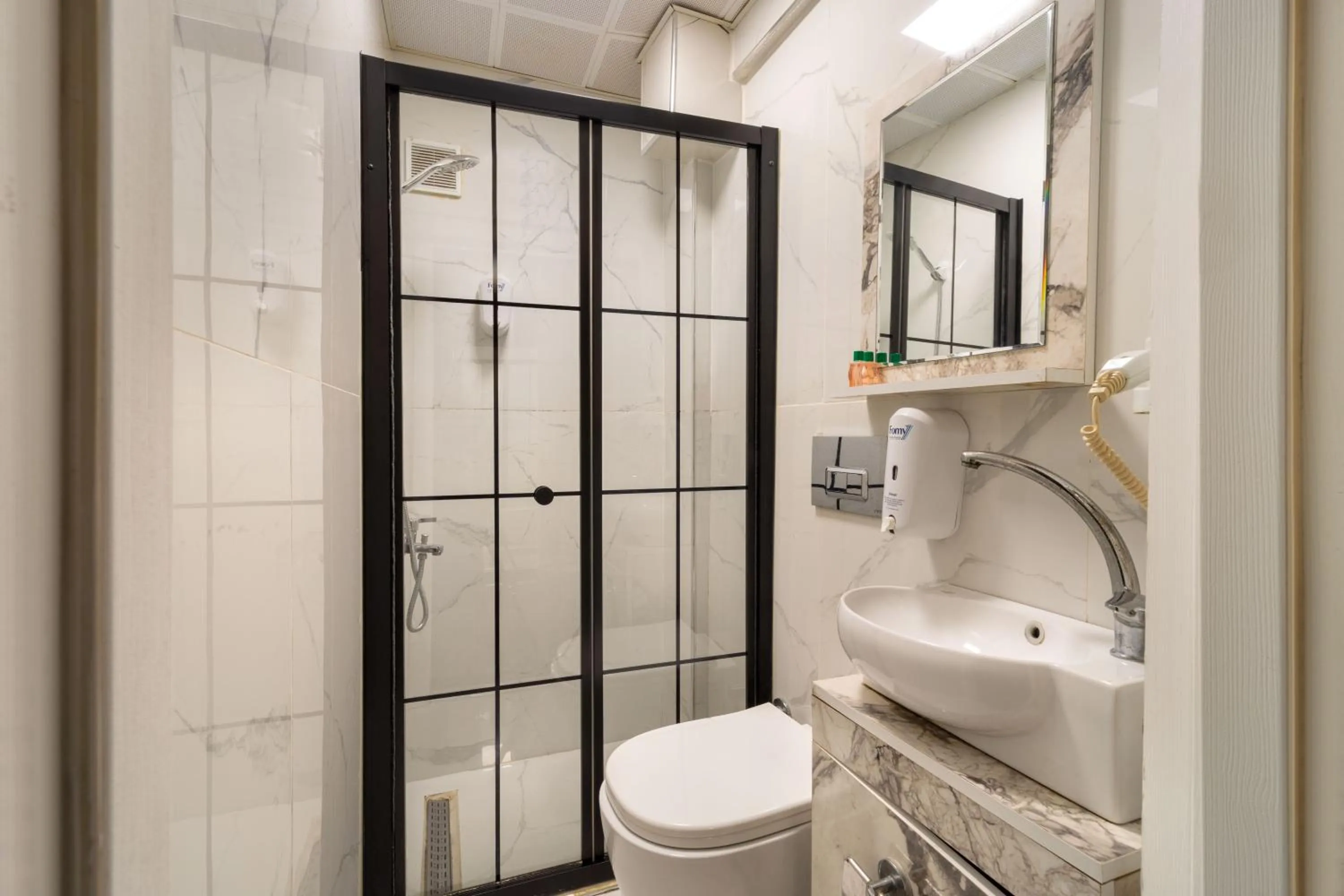 Shower in REN PLUS SUITES