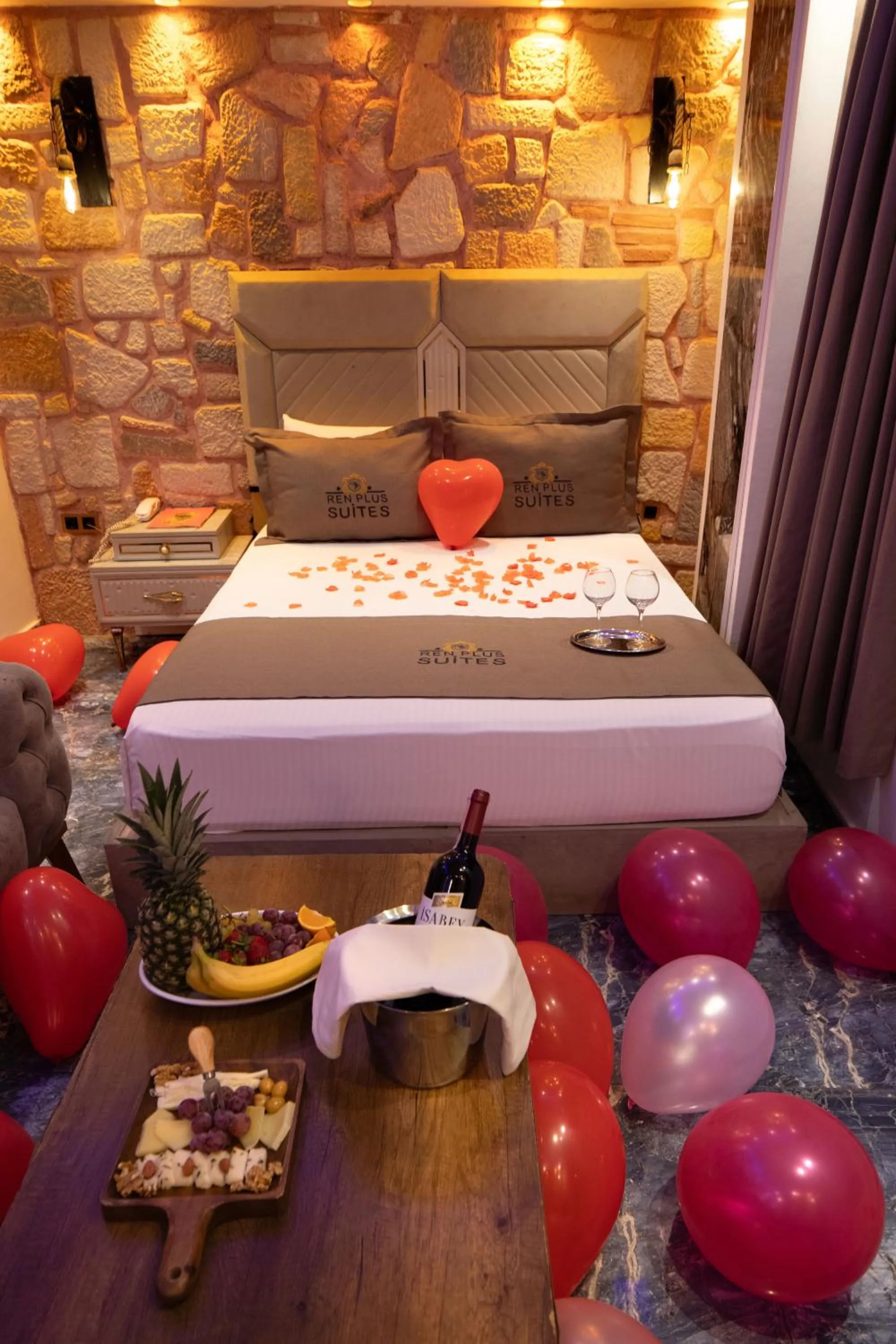 Bed in REN PLUS SUITES