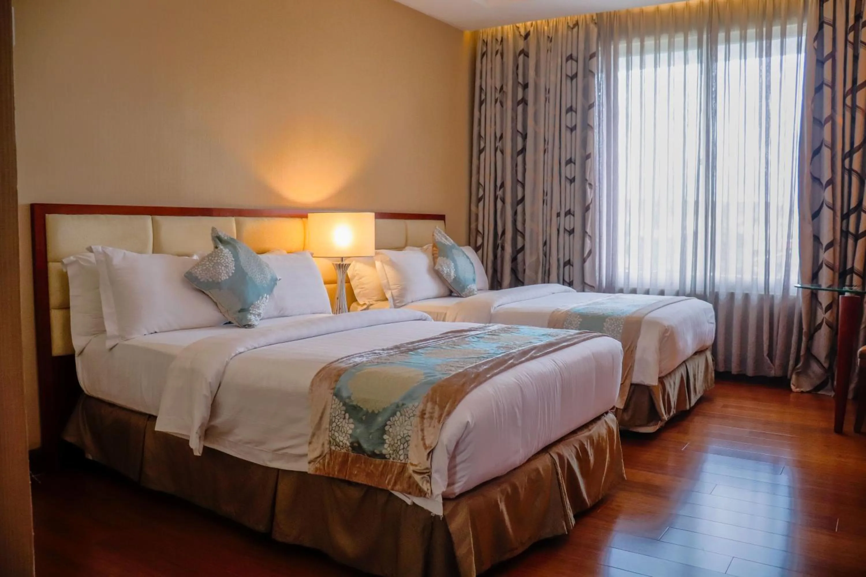 Bed in The Avenue Plaza Hotel