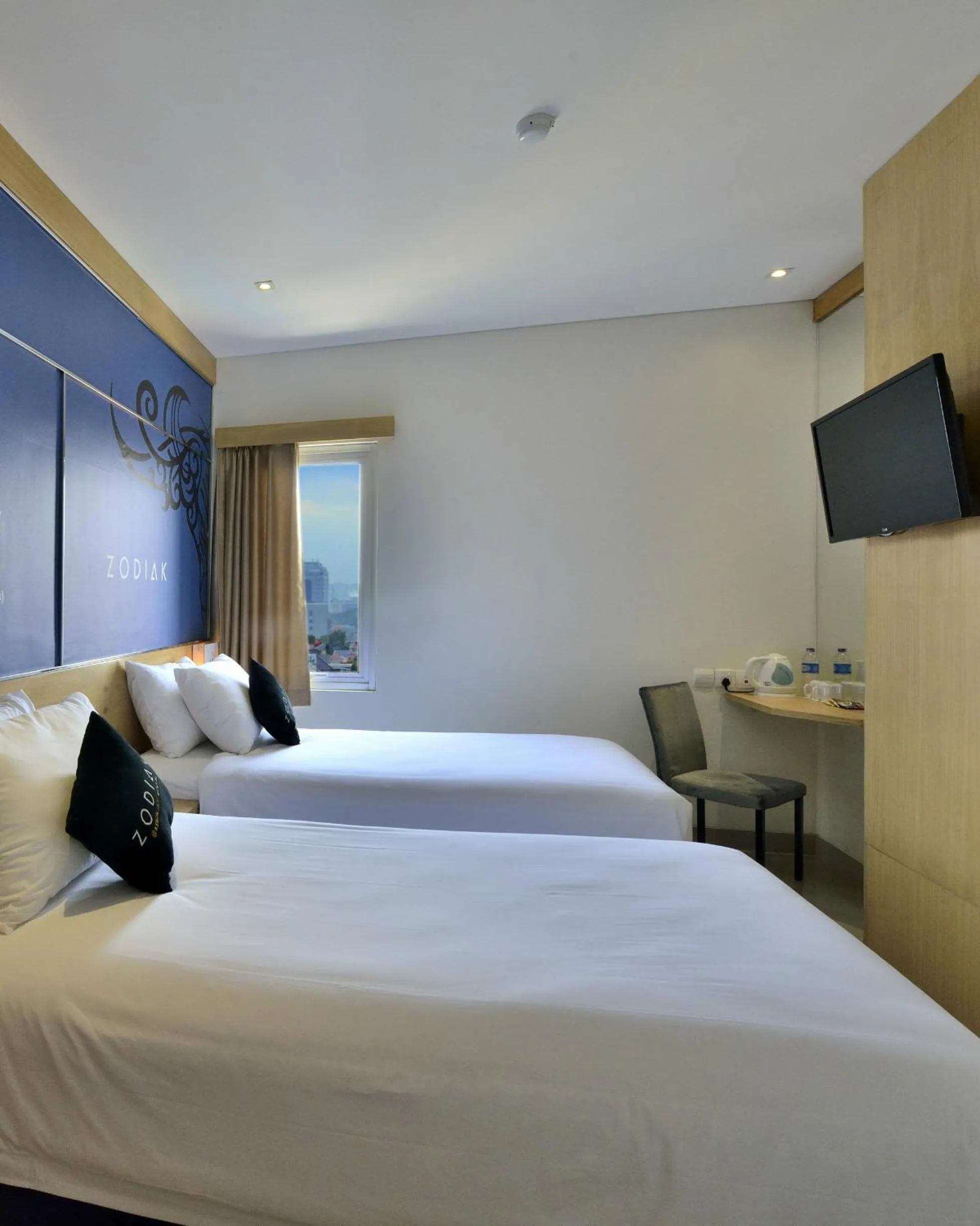 Bed in Zodiak at Kebon Jati Hotel