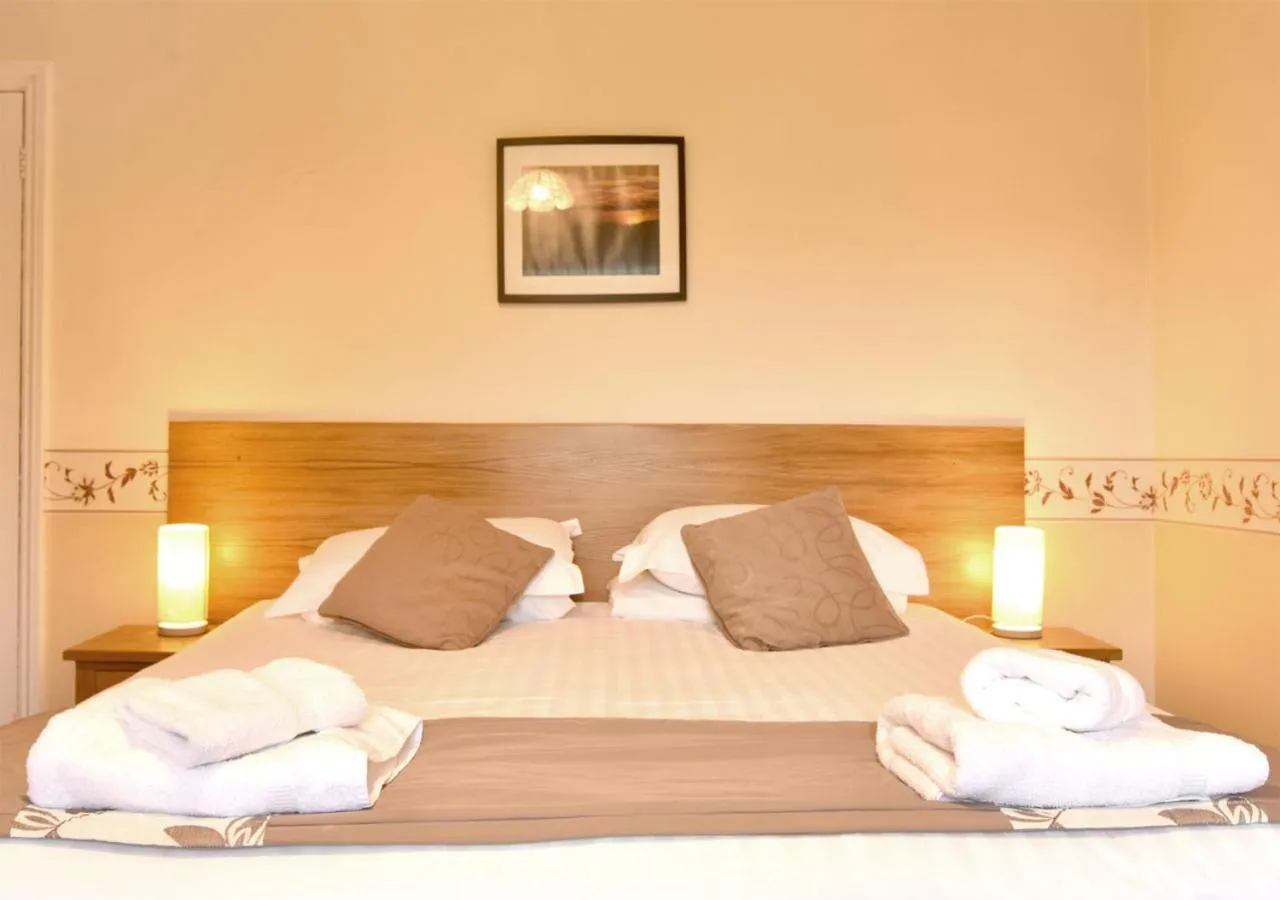Bed in Brook House Inn
