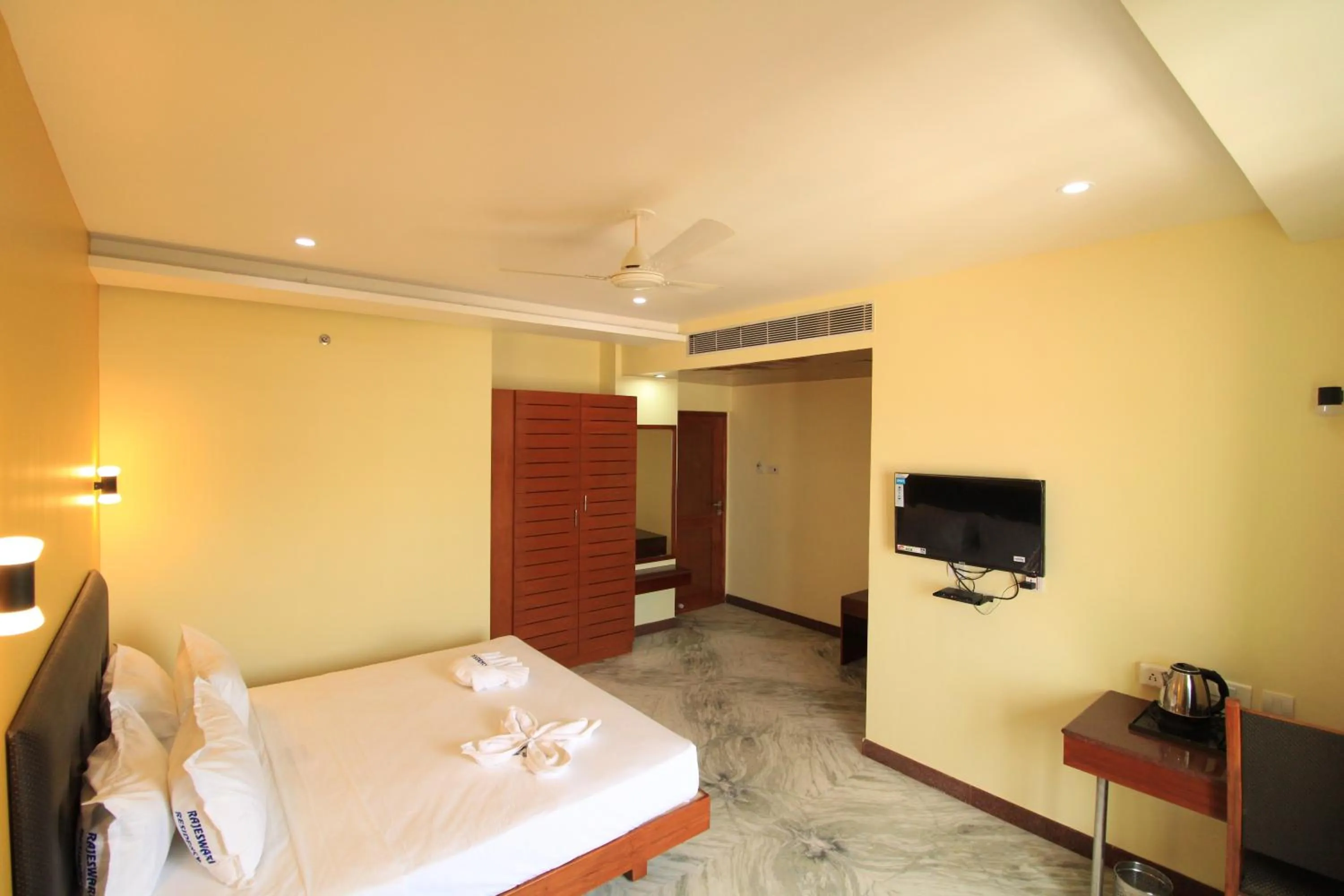 Photo of the whole room, Bed in Pondy Southern Residency