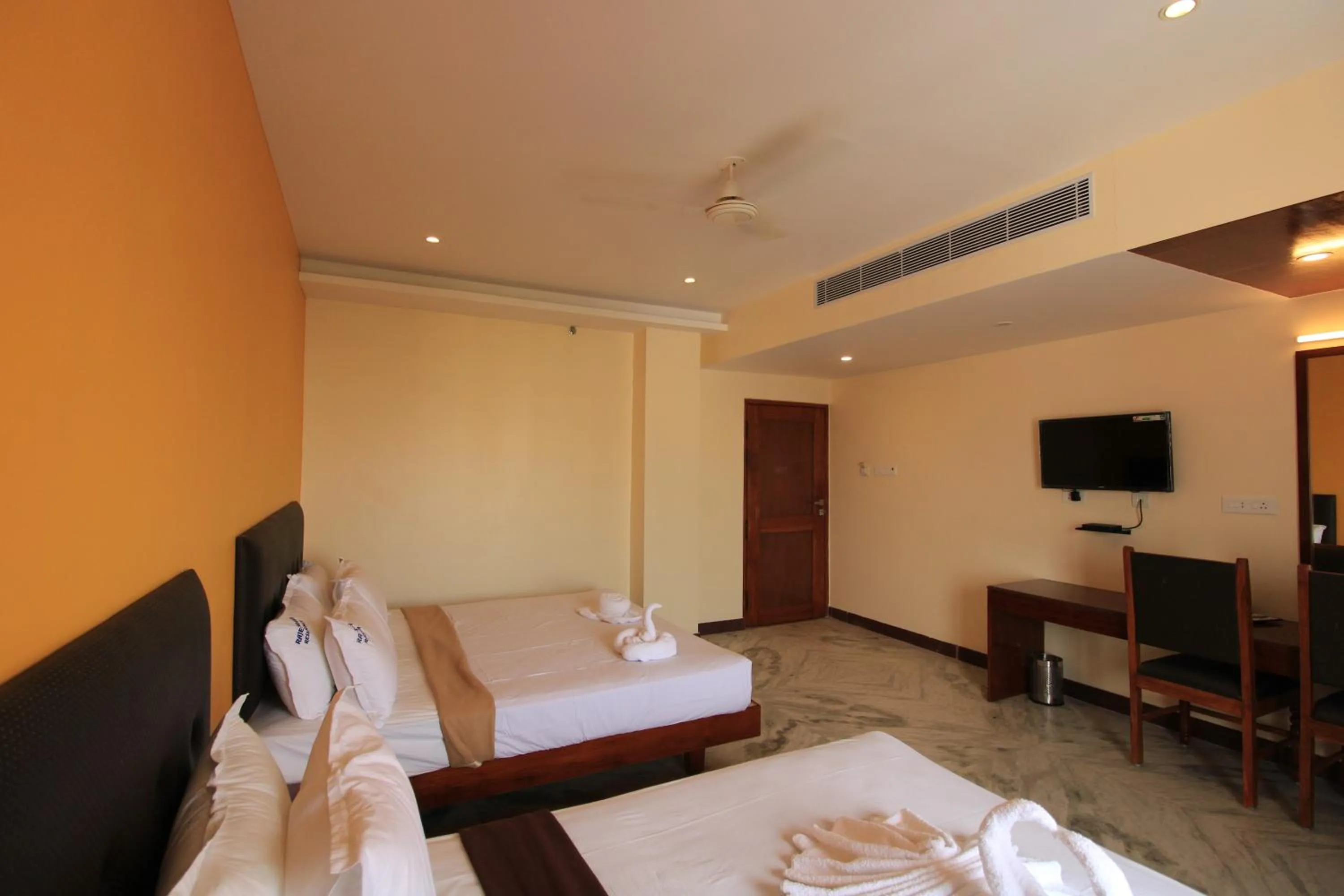Photo of the whole room, Bed in Pondy Southern Residency