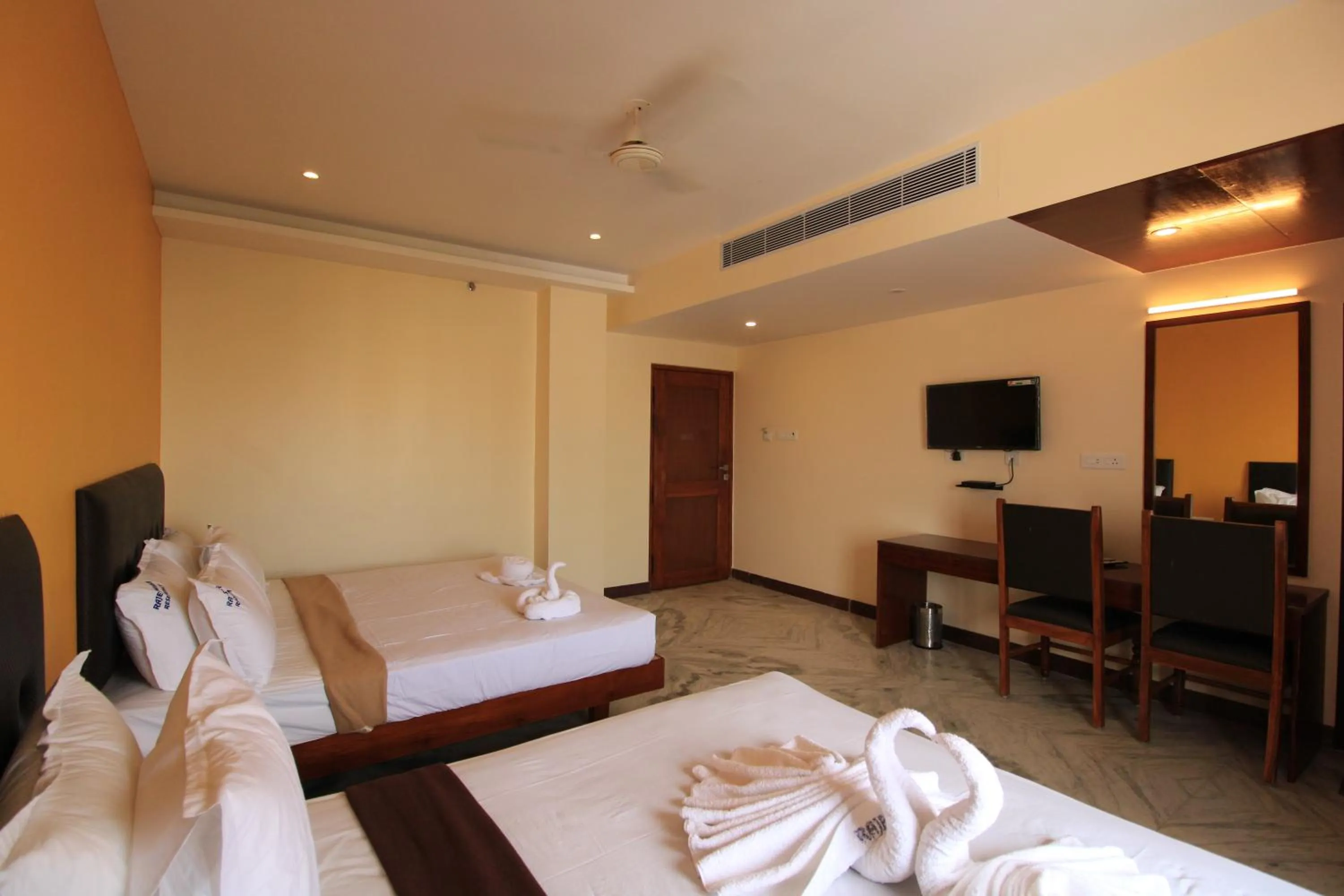 Photo of the whole room, Bed in Pondy Southern Residency