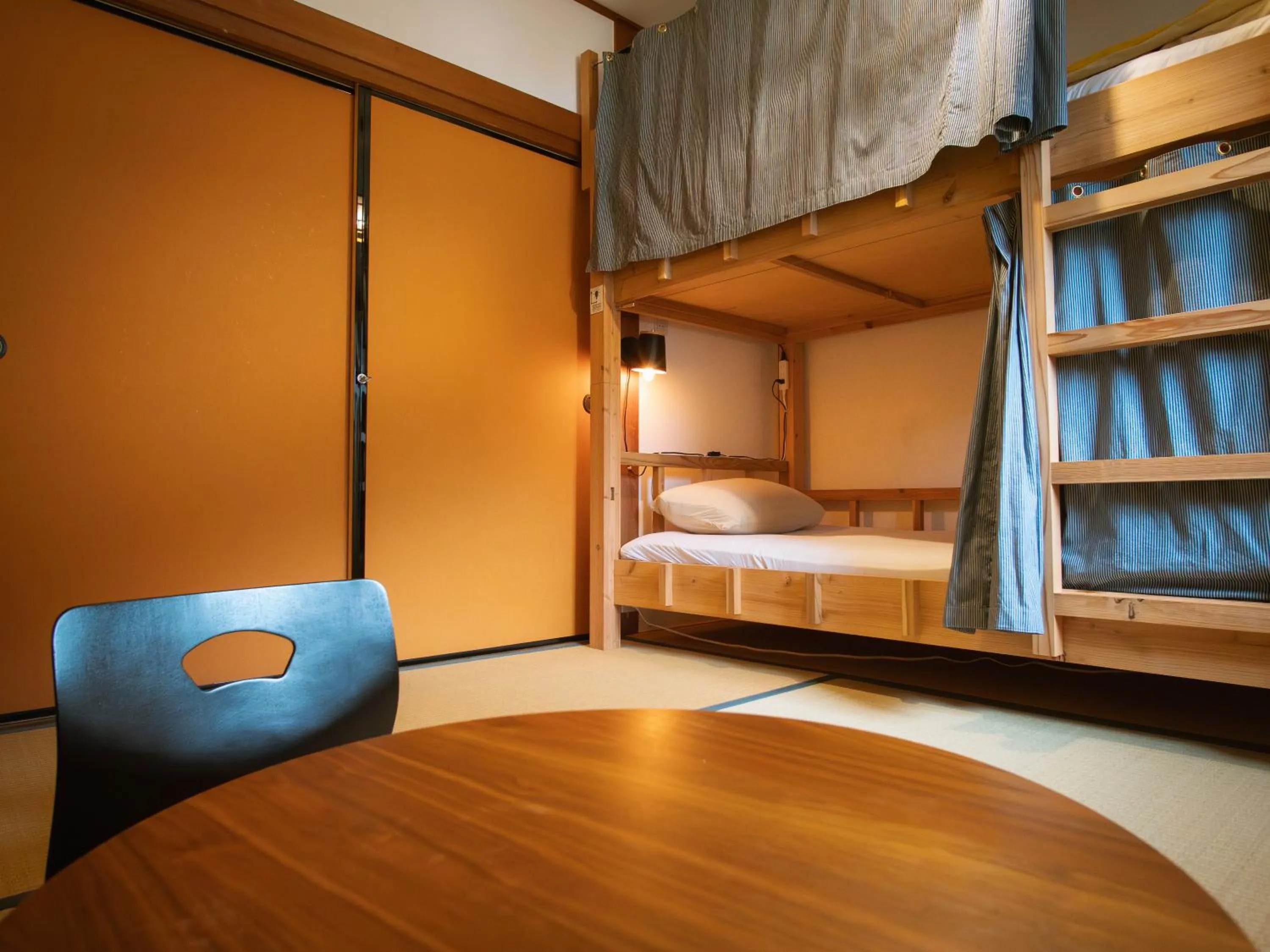 Seating area, Bed in Next Chapter - Guesthouse - Kito