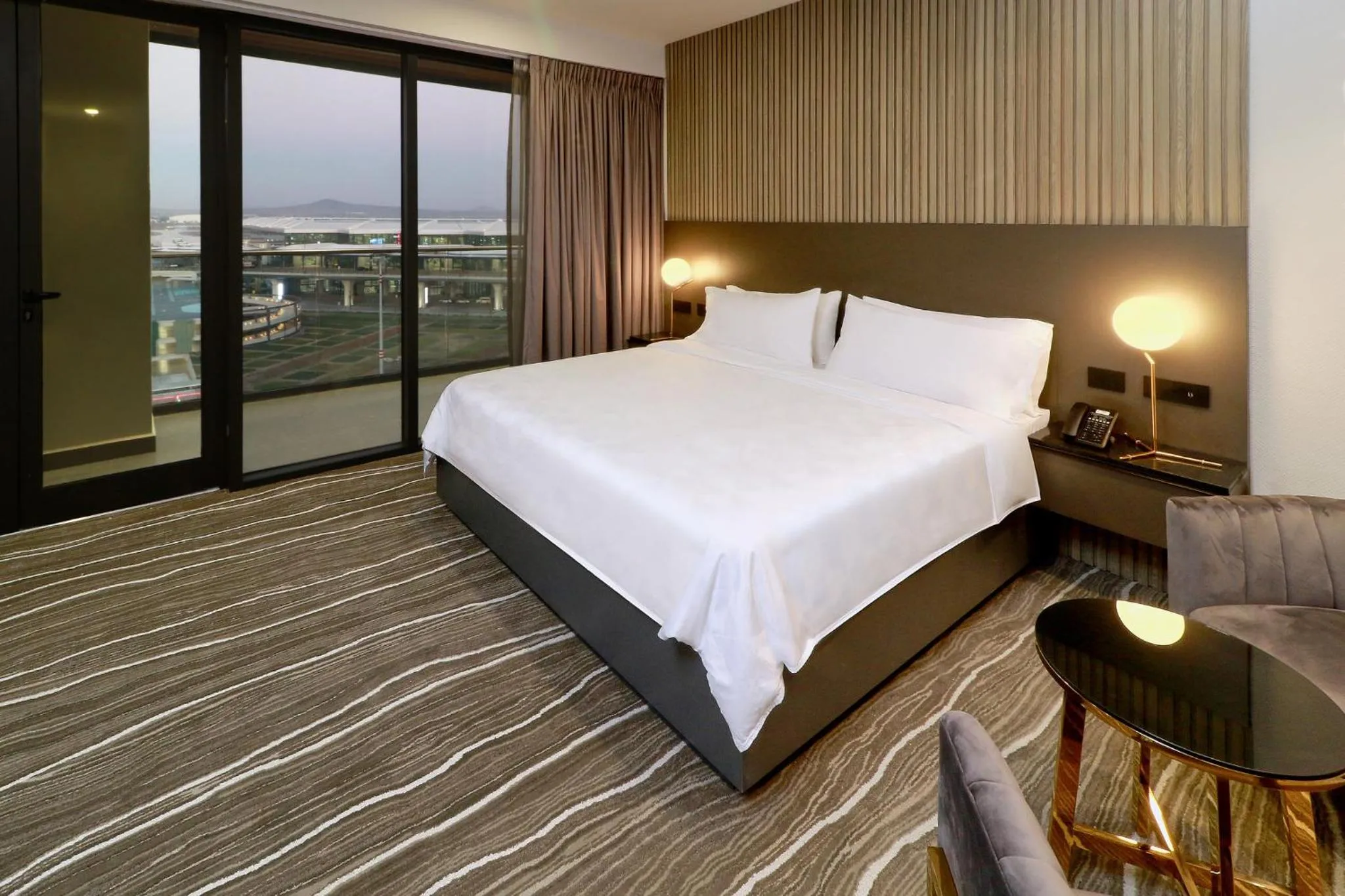 Photo of the whole room, Bed in Holiday Inn & Suites - Mexico Felipe Angeles Airport by IHG