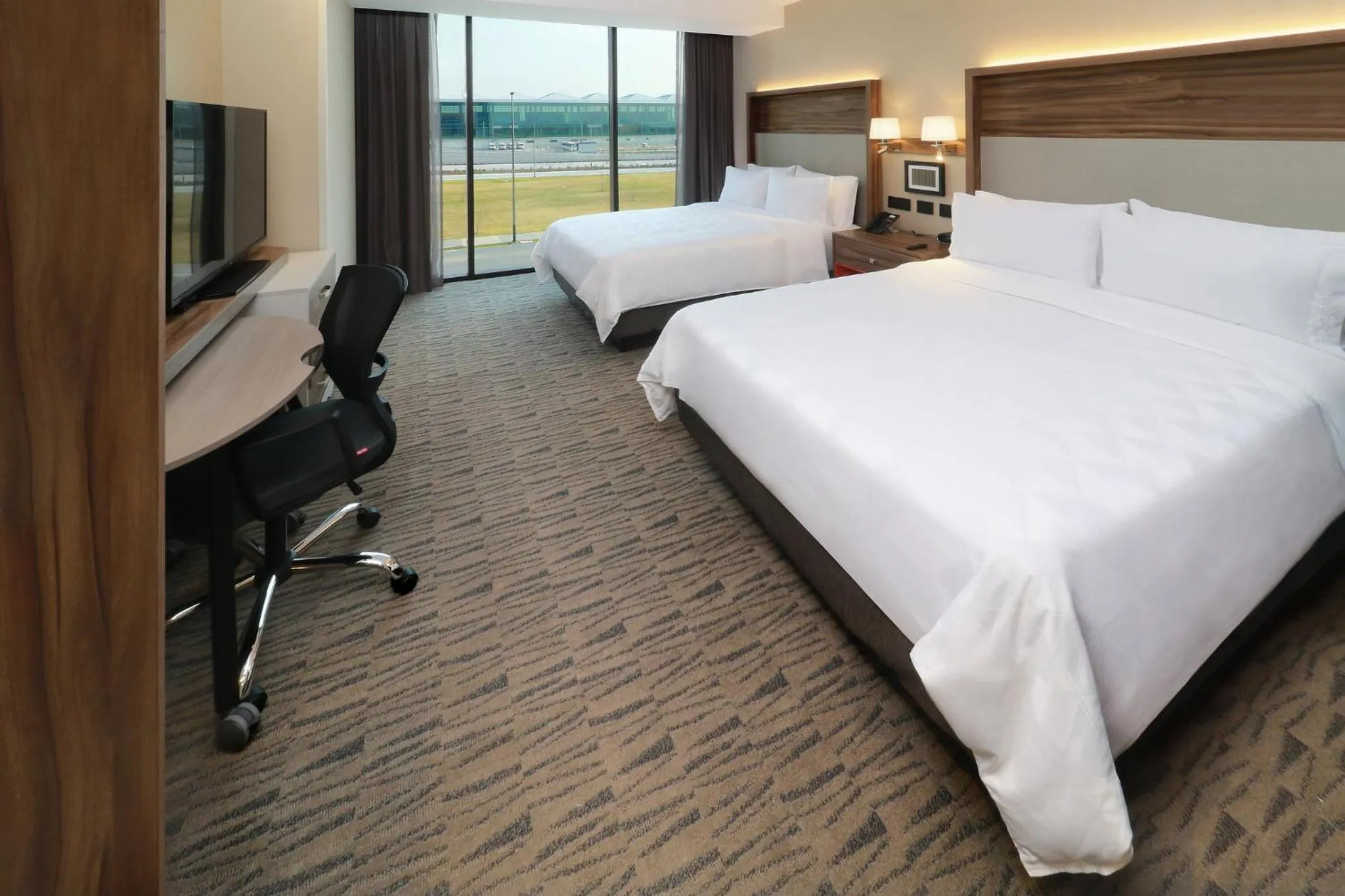 Photo of the whole room, Bed in Holiday Inn & Suites - Mexico Felipe Angeles Airport by IHG