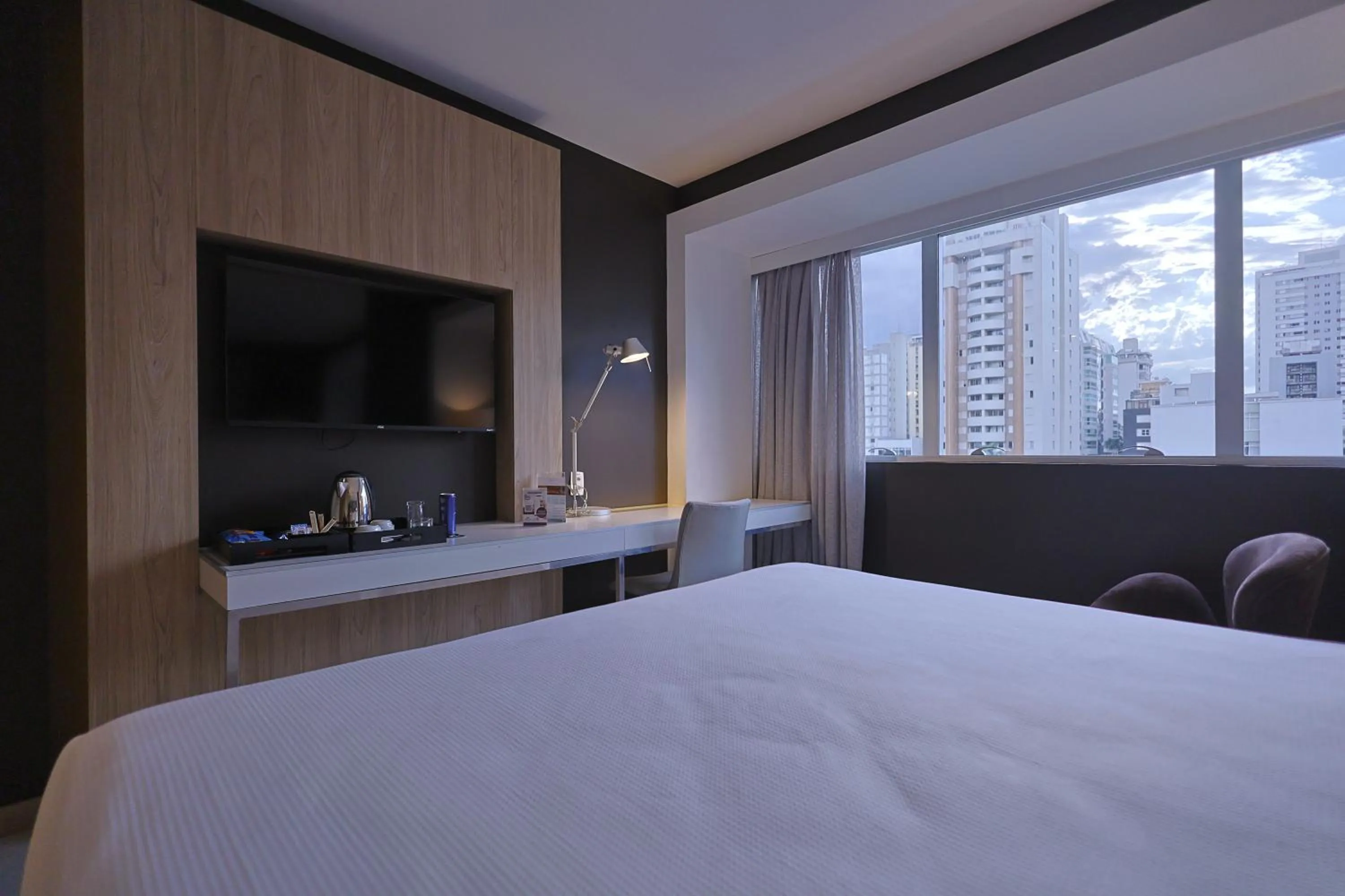 Bed in eSuites Savassi Toscanini