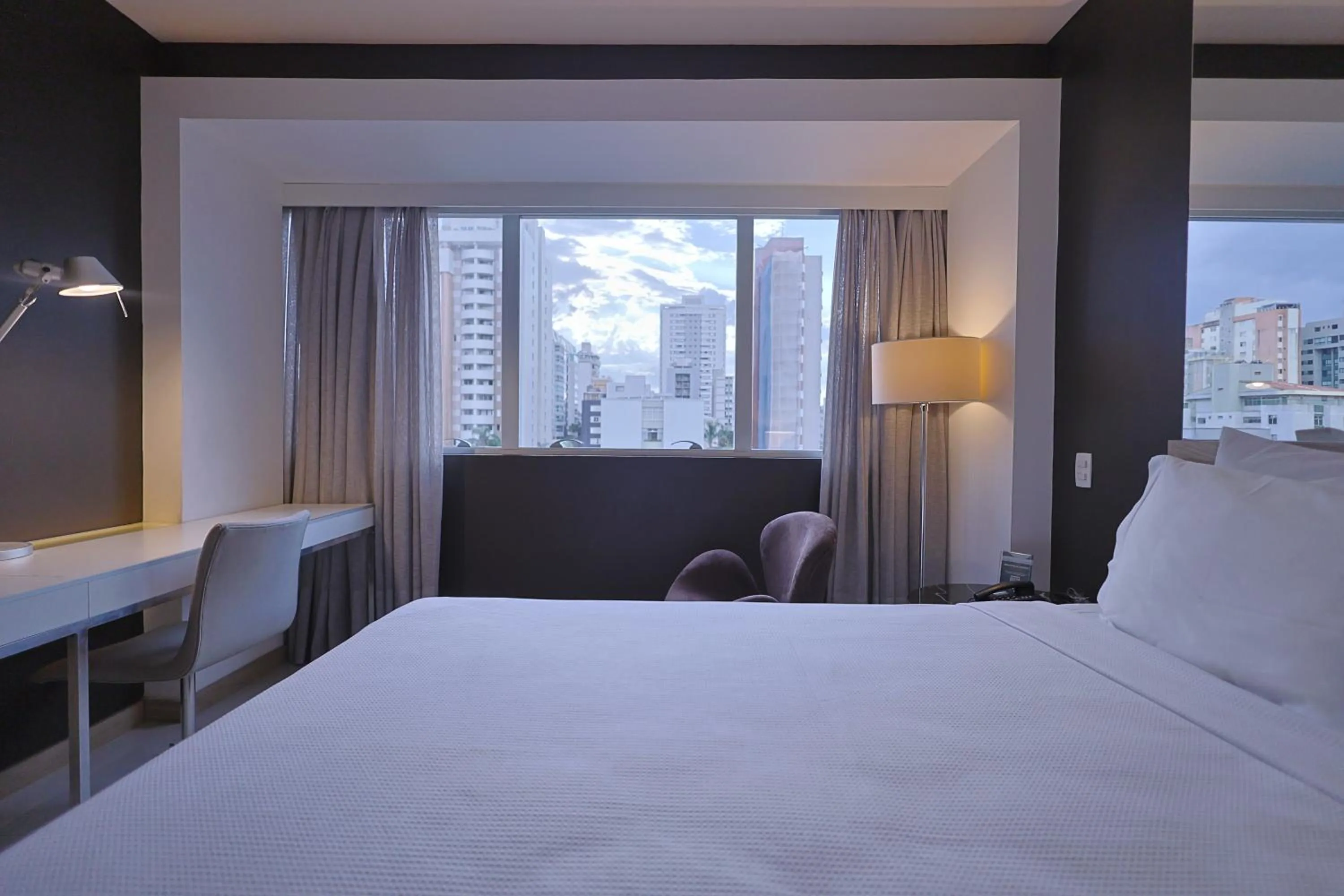 Bed in eSuites Savassi Toscanini