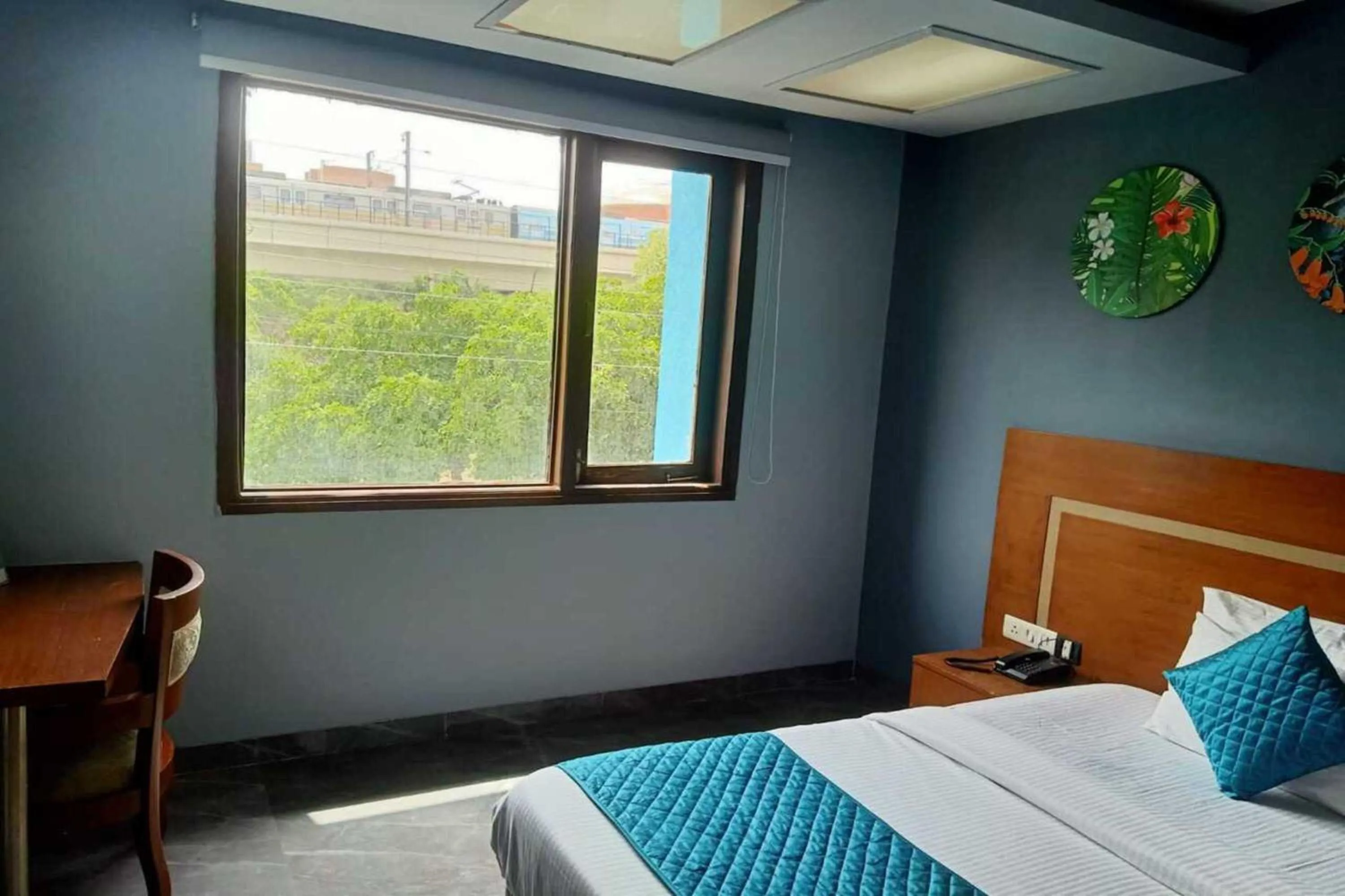 Photo of the whole room, Bed in Asian Suites IFFCO Metro Station Gurugram