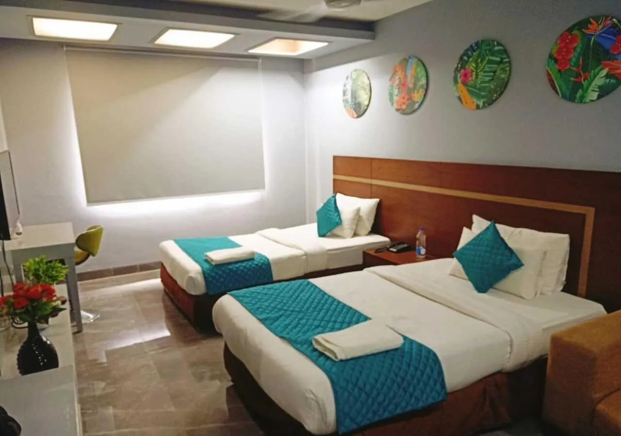 Photo of the whole room, Bed in Asian Suites IFFCO Metro Station Gurugram