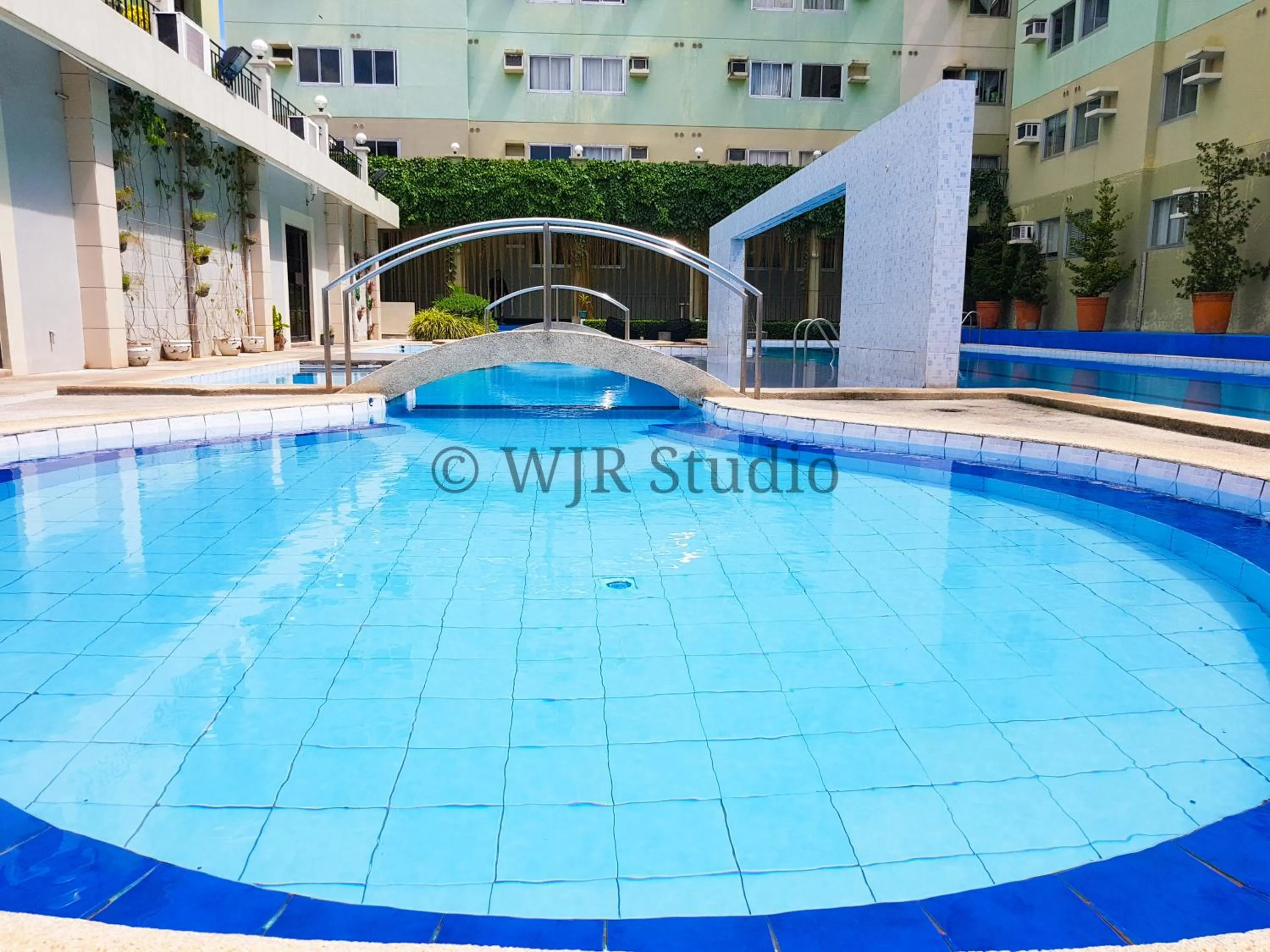 Swimming pool in Centropolis Queen Bed Suite- Modern Posh Style