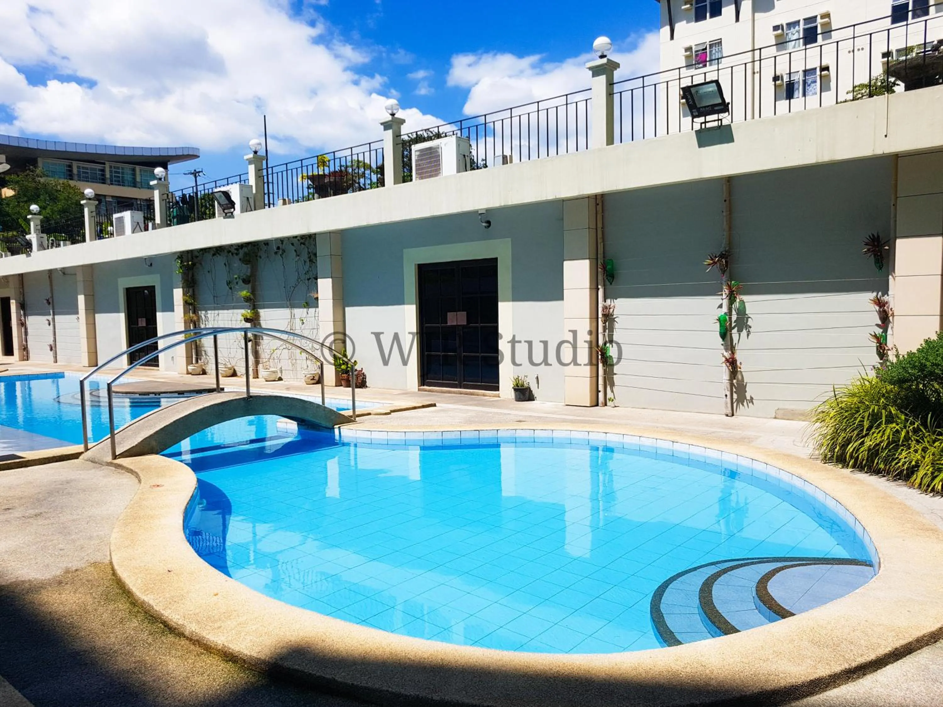 Swimming pool in Centropolis Queen Bed Suite- Modern Posh Style
