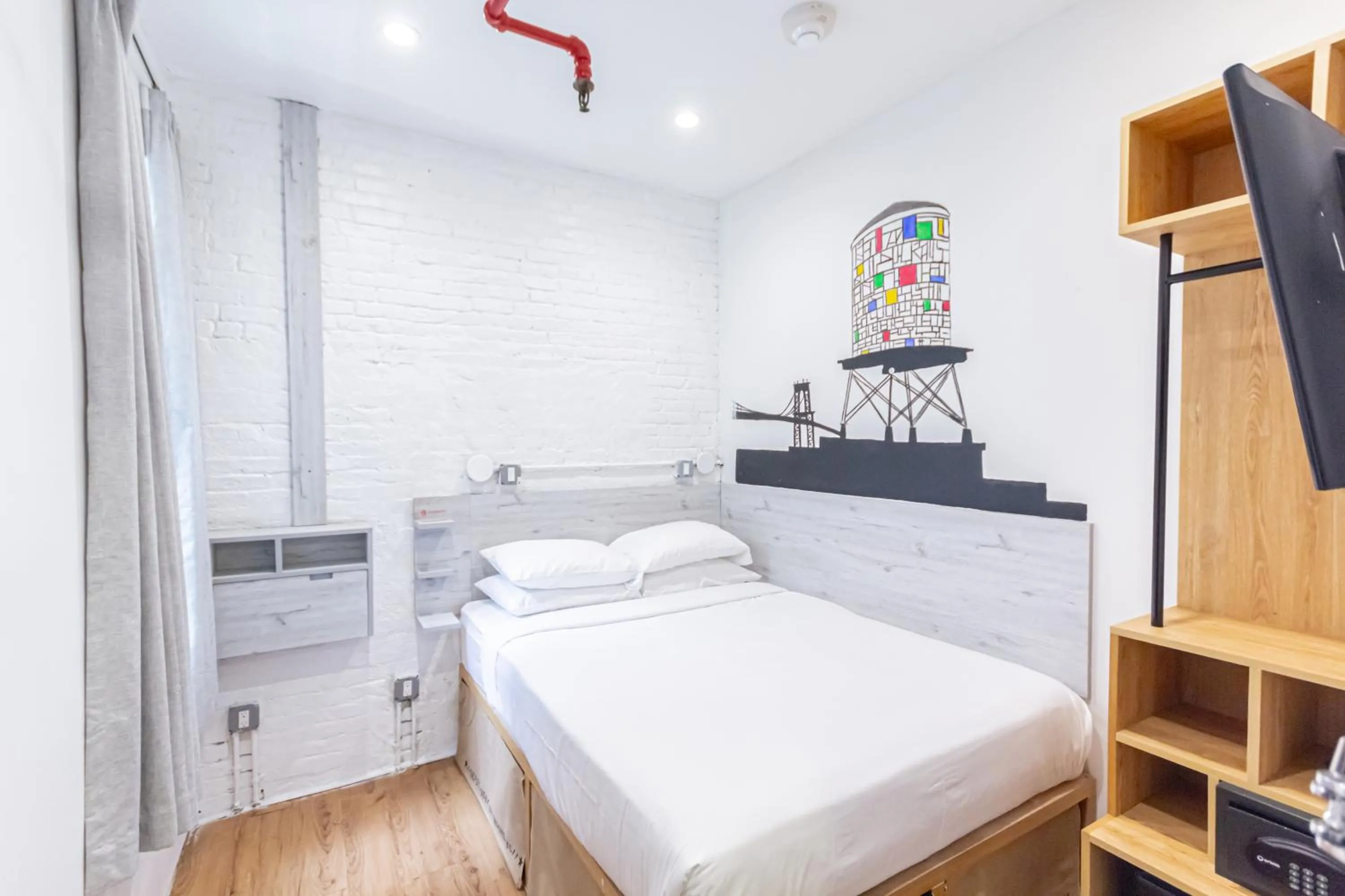 Bed in JG Times SQ Hotel by JGSTAY