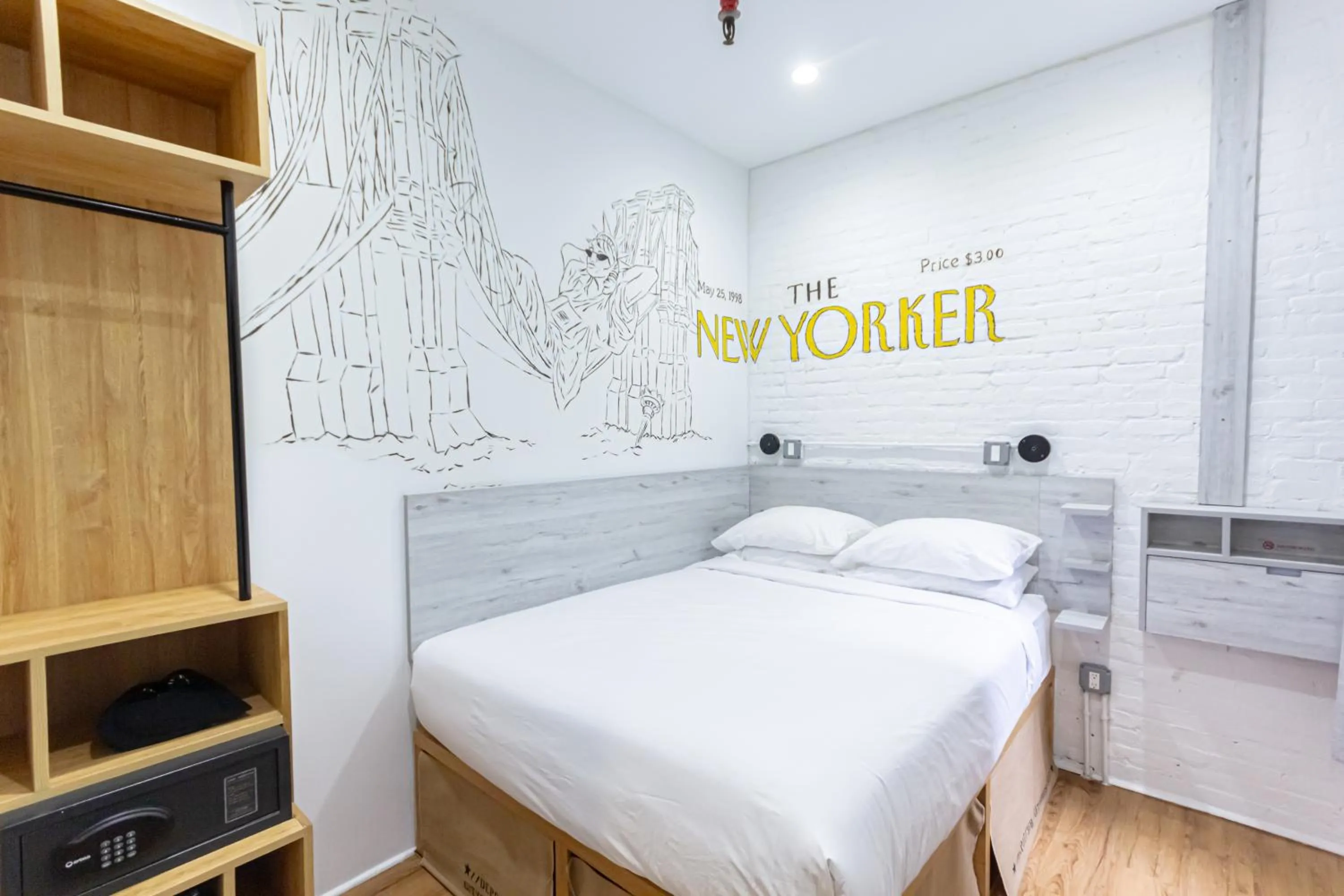 Bed in JG Times SQ Hotel by JGSTAY