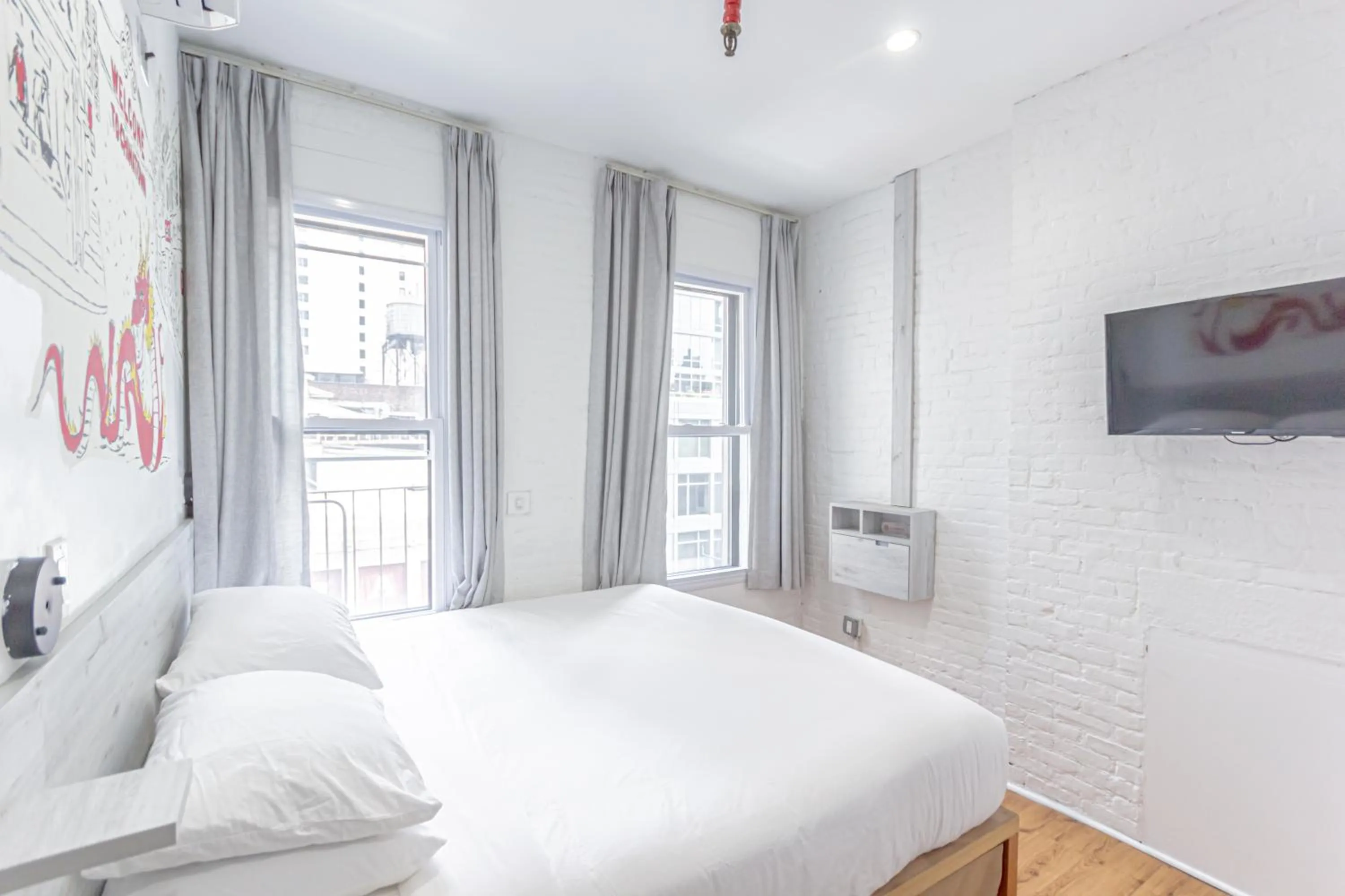 Bed in JG Times SQ Hotel by JGSTAY