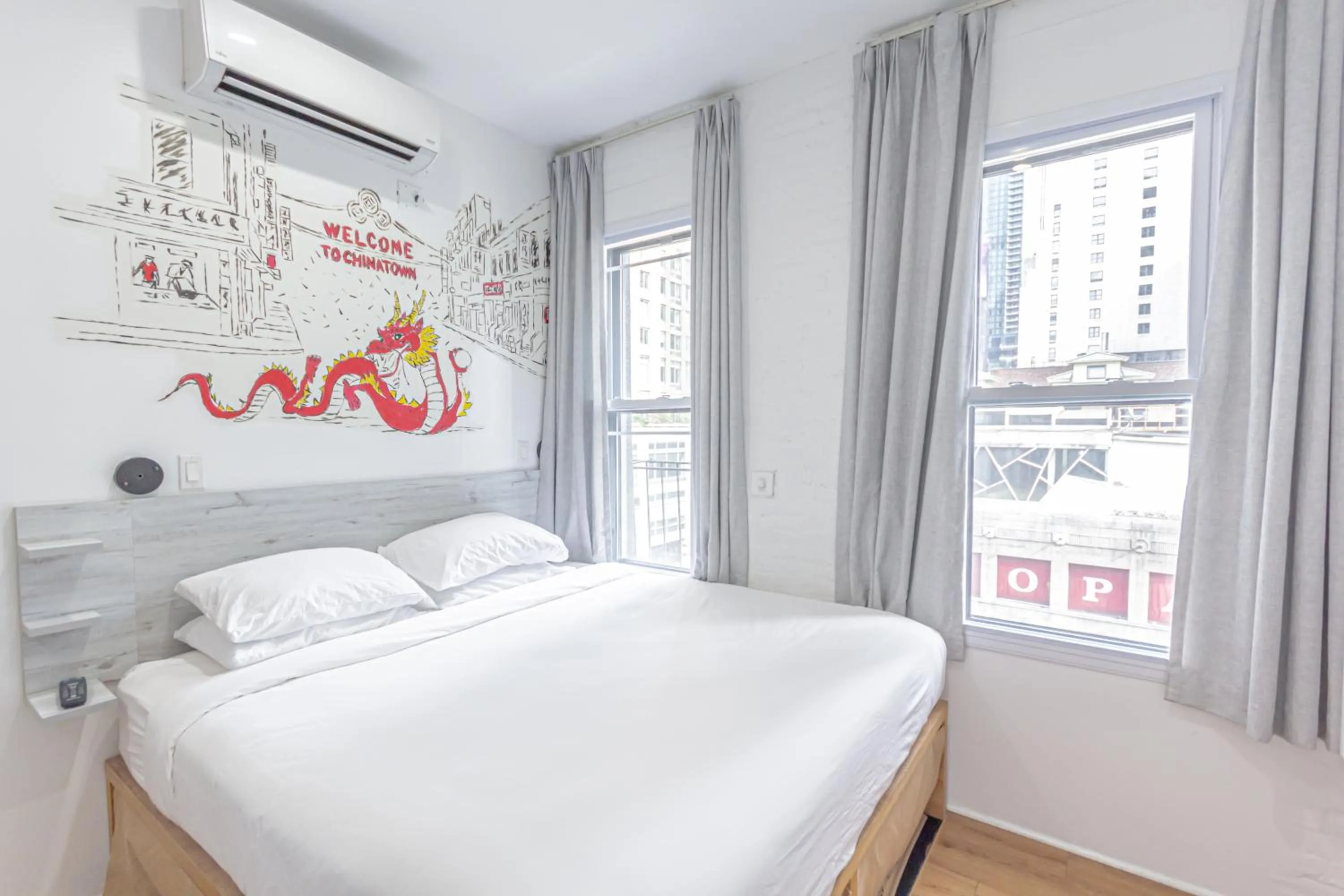 Bed in JG Times SQ Hotel by JGSTAY