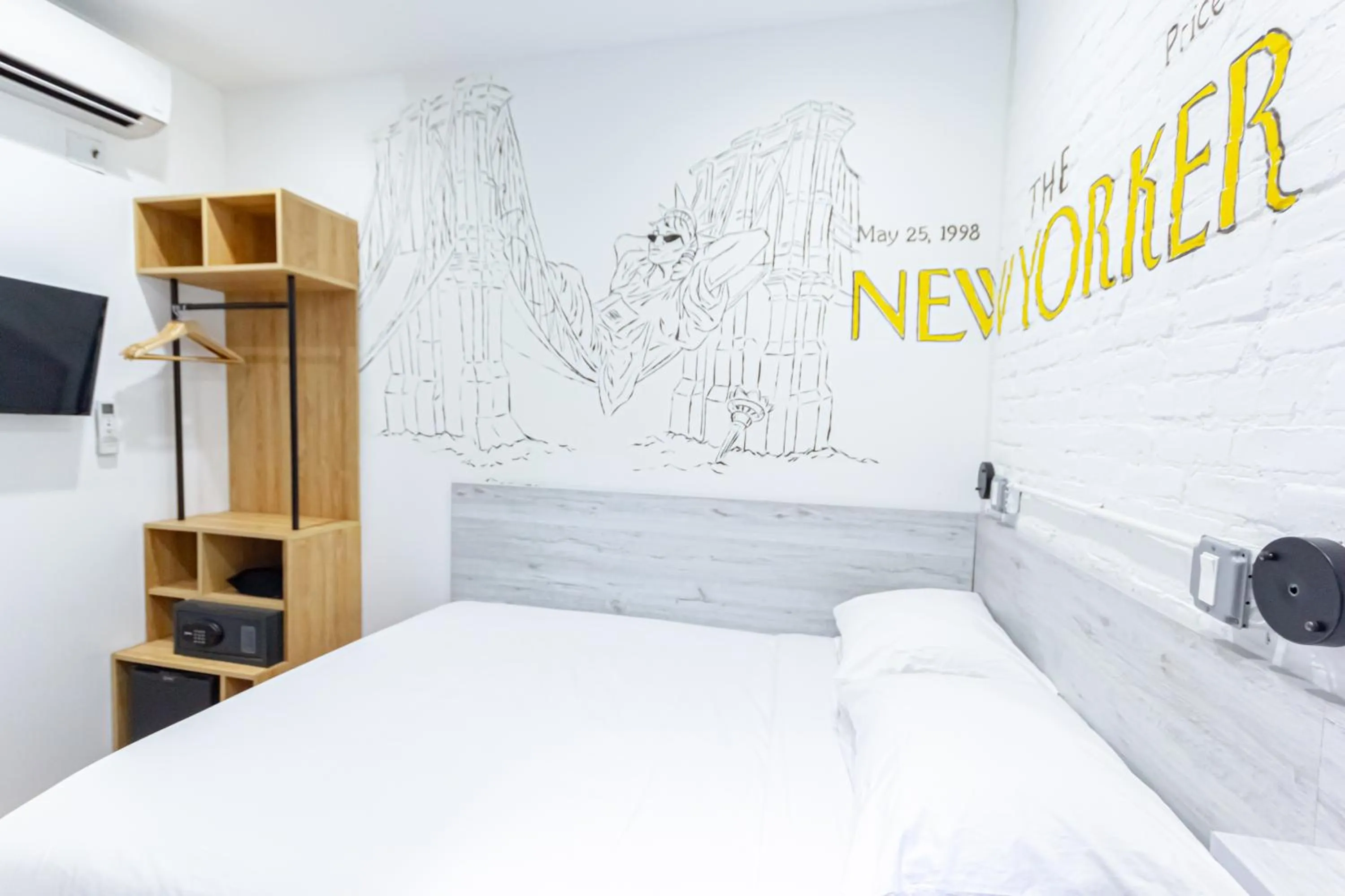 Bed in JG Times SQ Hotel by JGSTAY