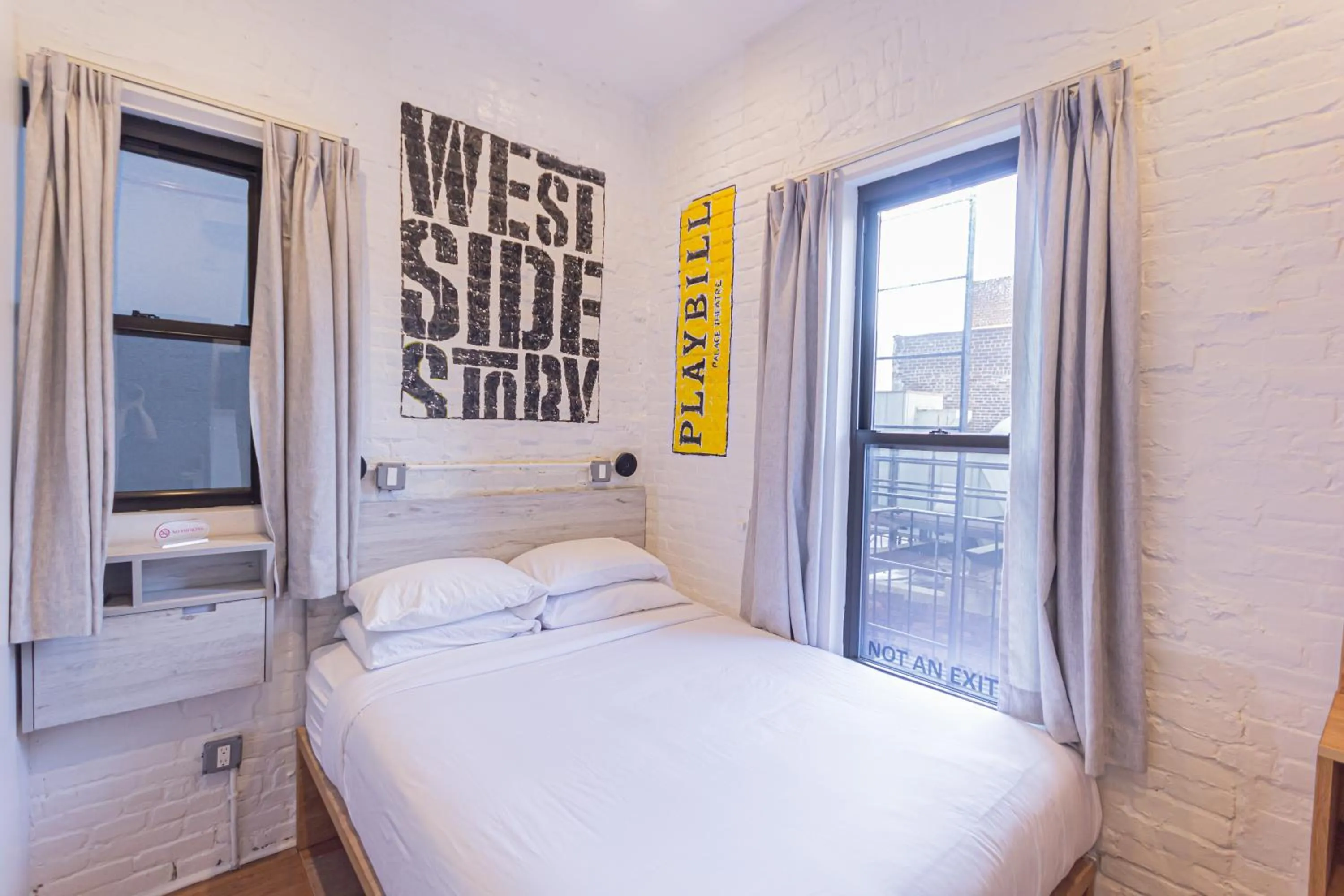 Bed in JG Times SQ Hotel by JGSTAY