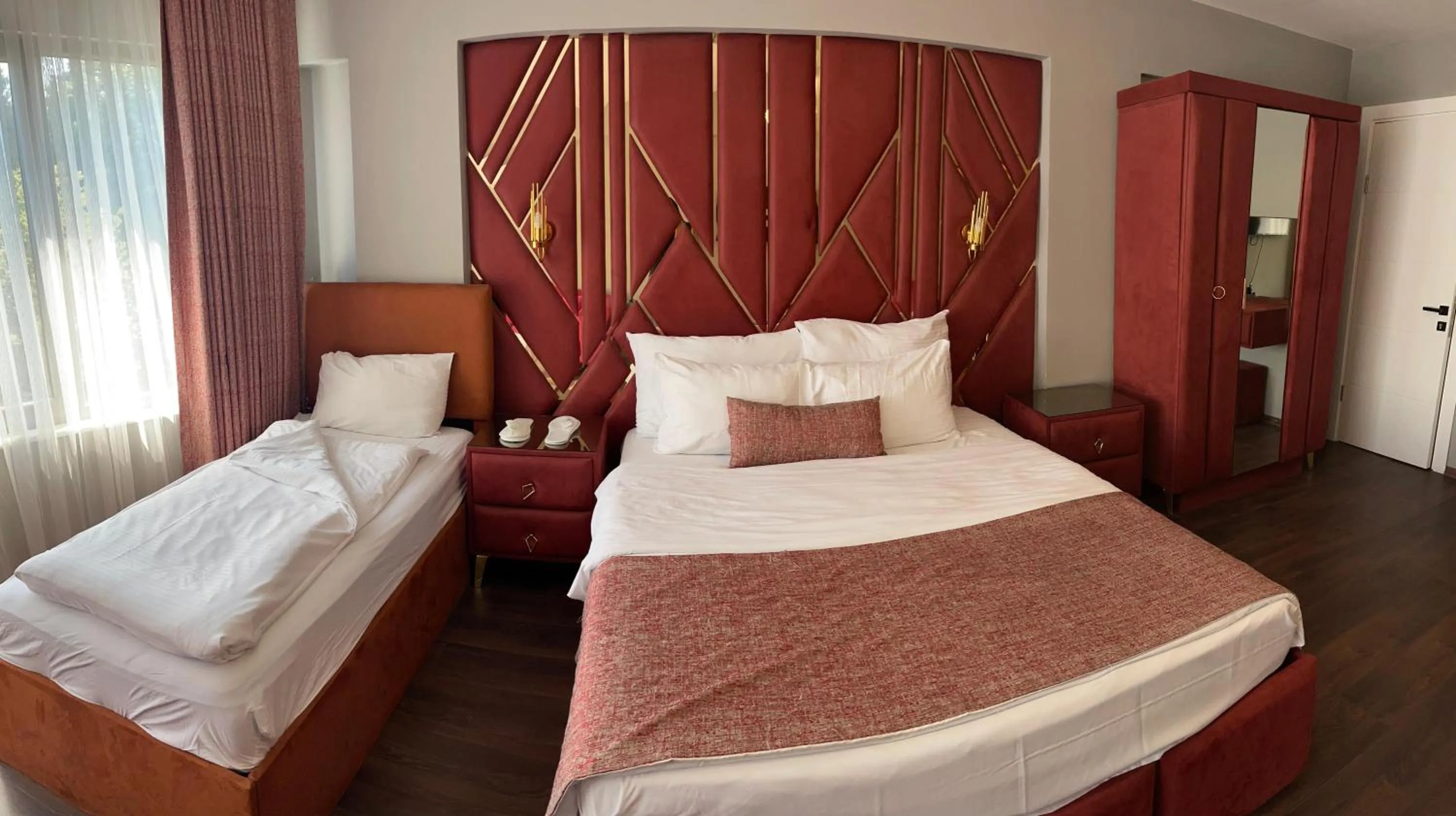 Bed in Aymira Suite Hotel