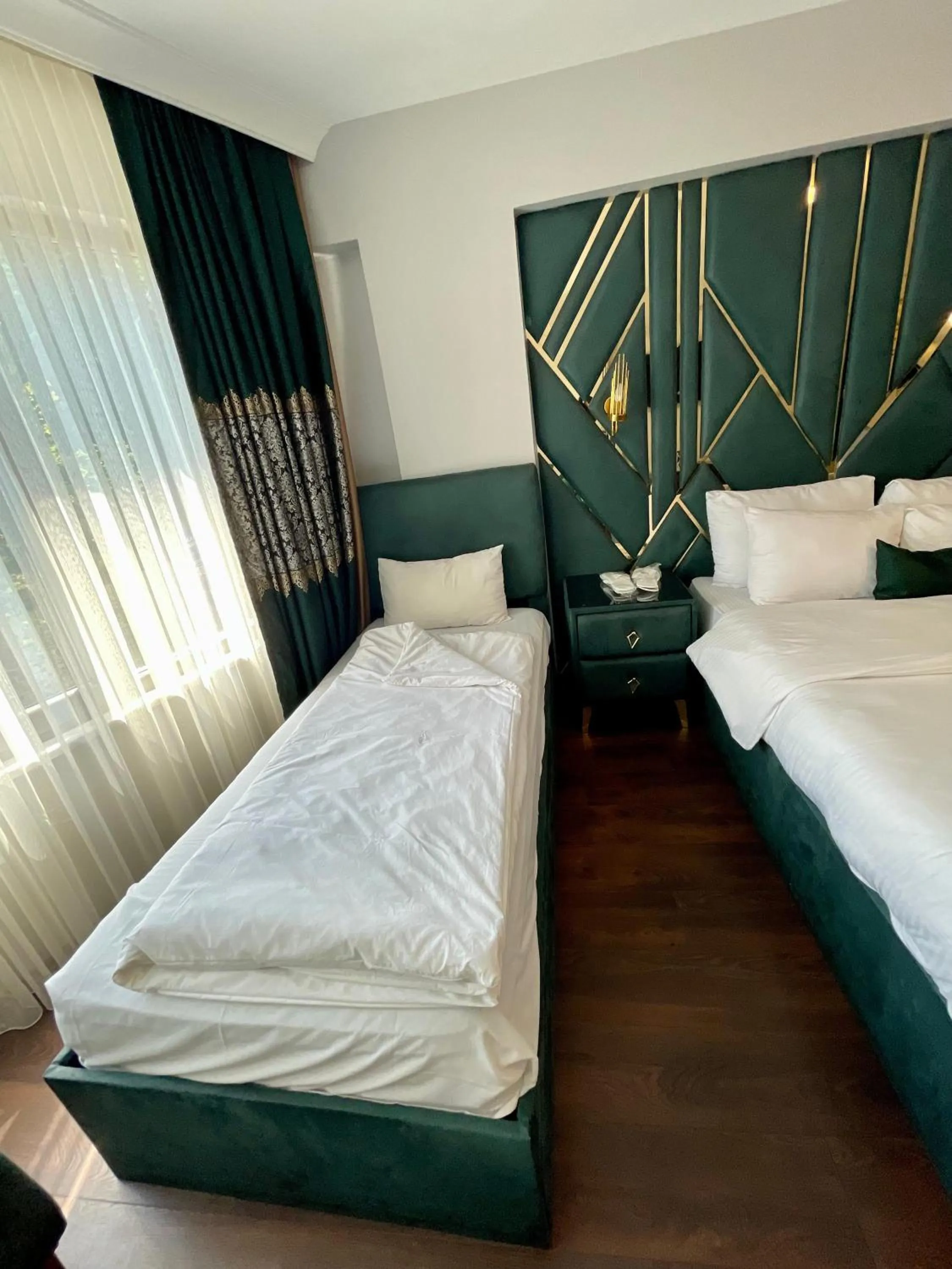 Bed in Aymira Suite Hotel