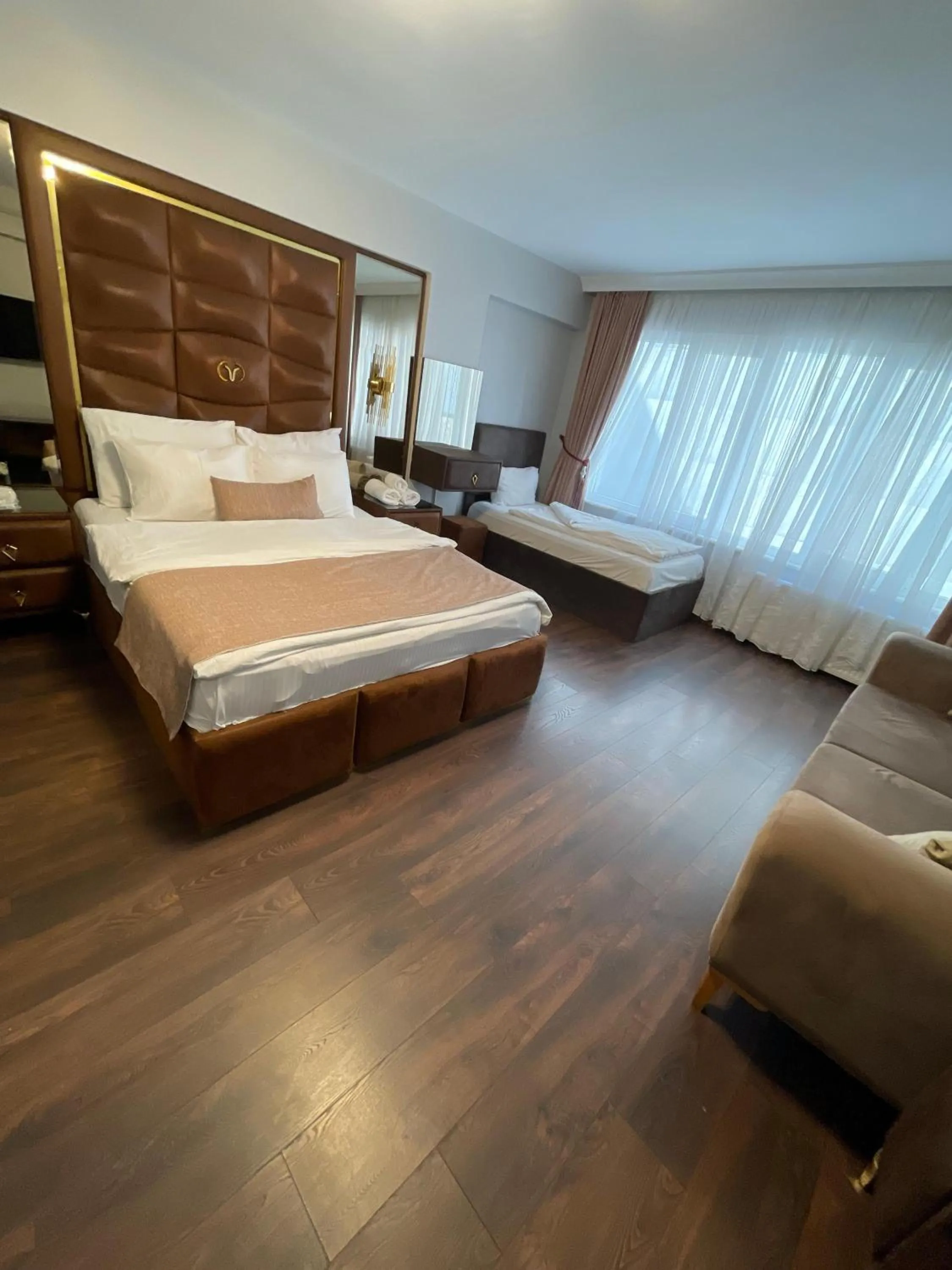 Bed in Aymira Suite Hotel