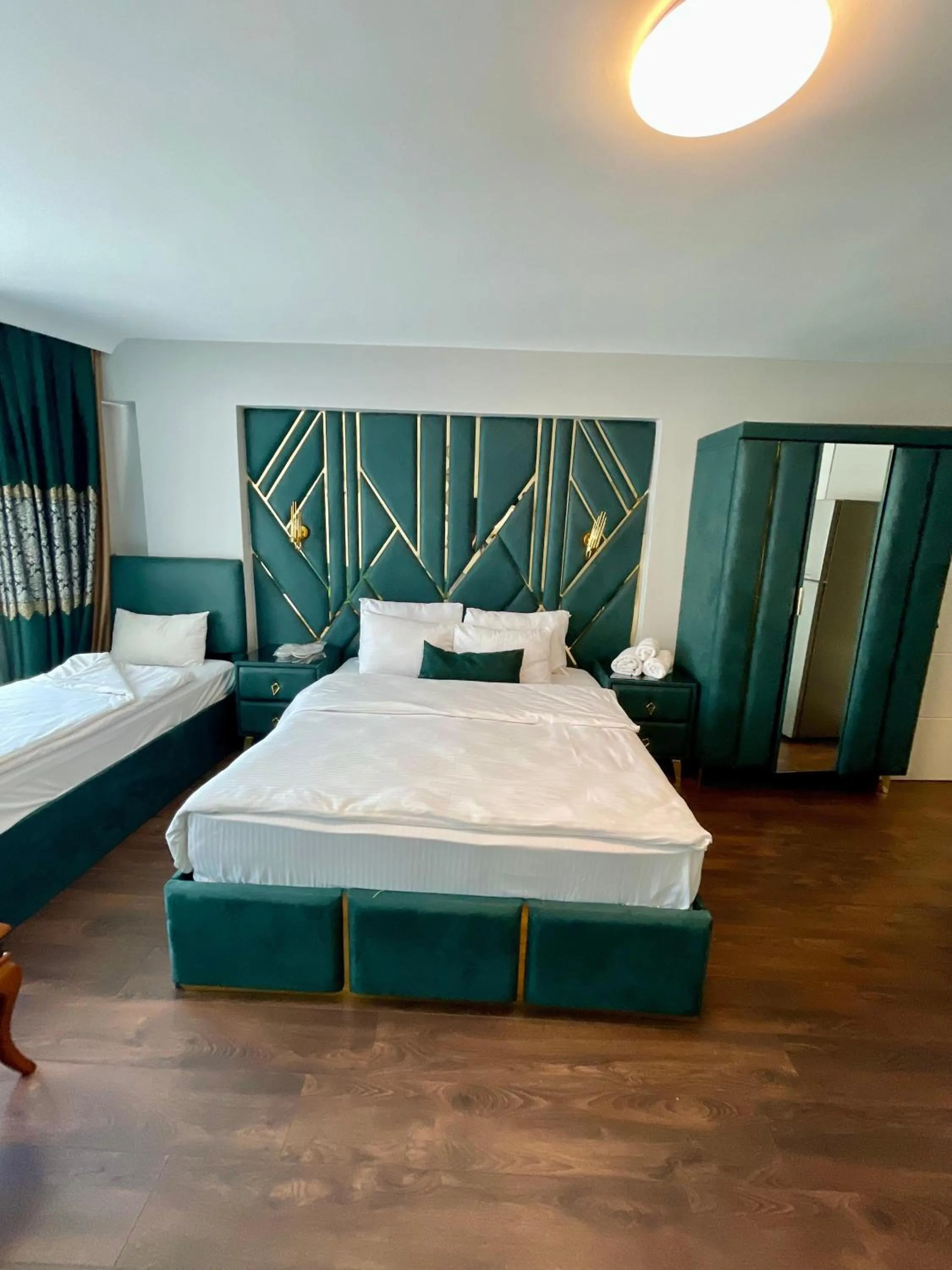 Bed in Aymira Suite Hotel