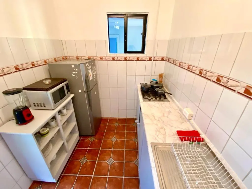 Kitchen or kitchenette in Kahina Lodge