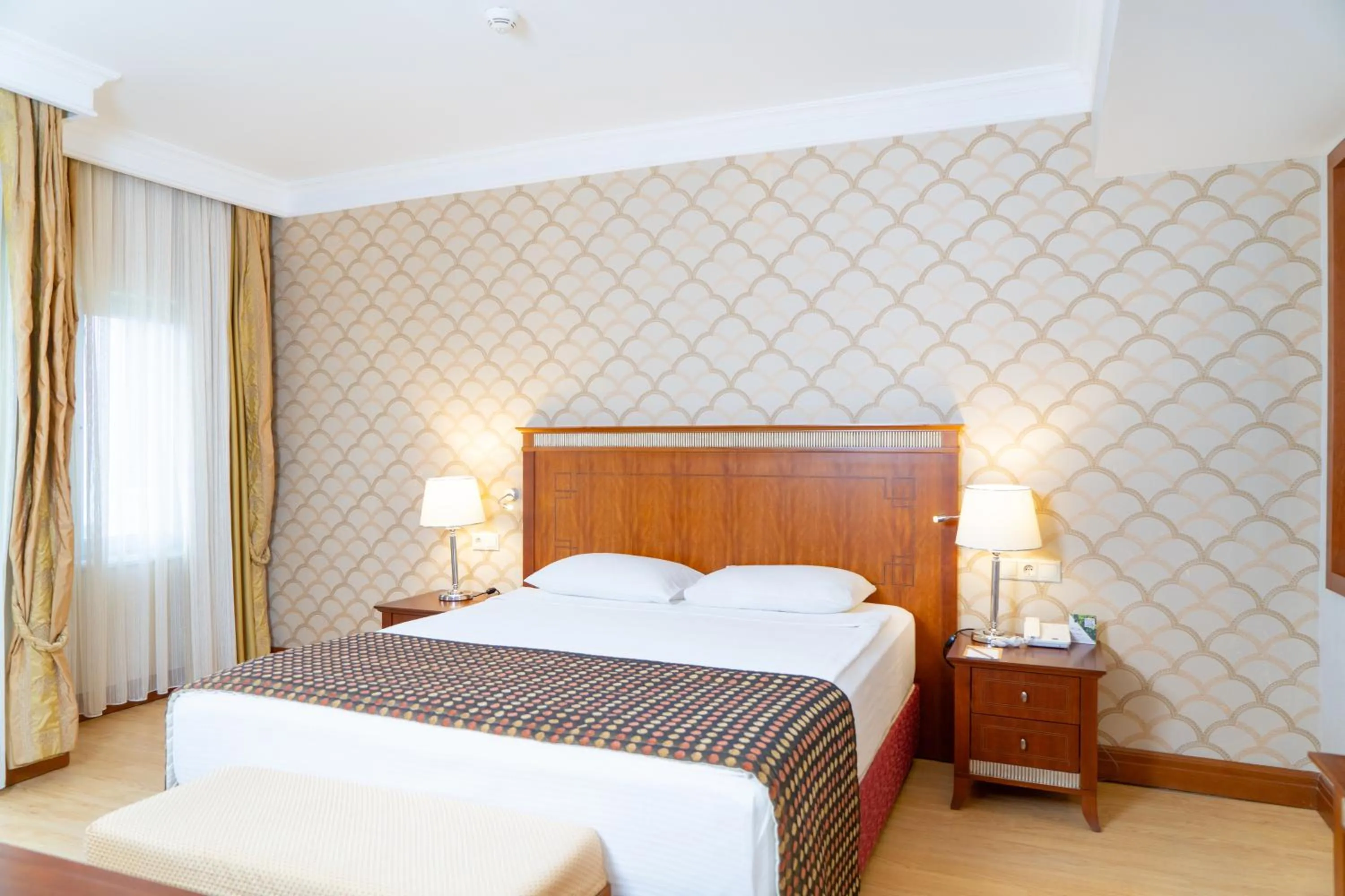 Bed in Belconti Resort Hotel