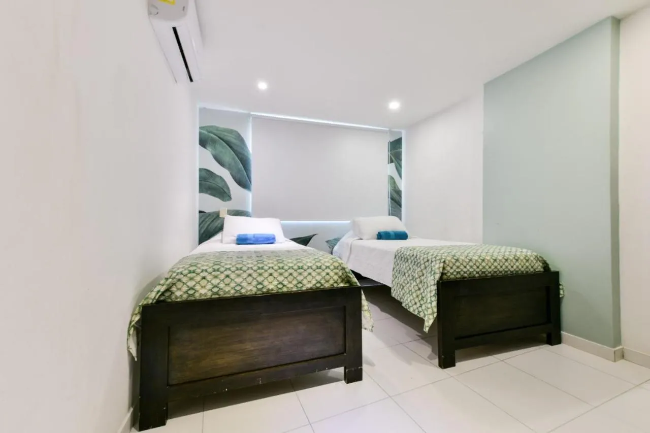 Bed in Tropical Breeze Apartamentos