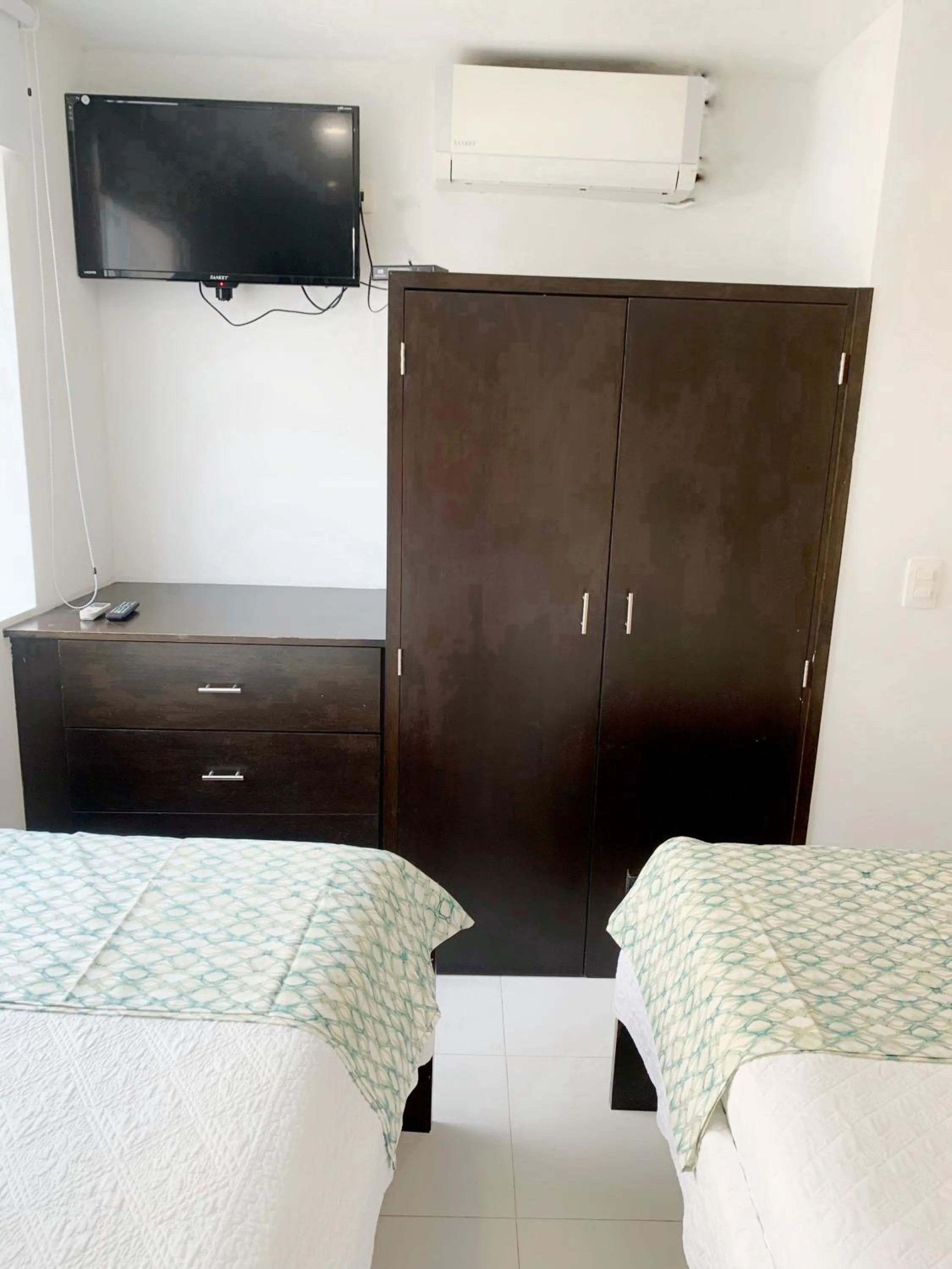 Bed in Tropical Breeze Apartamentos