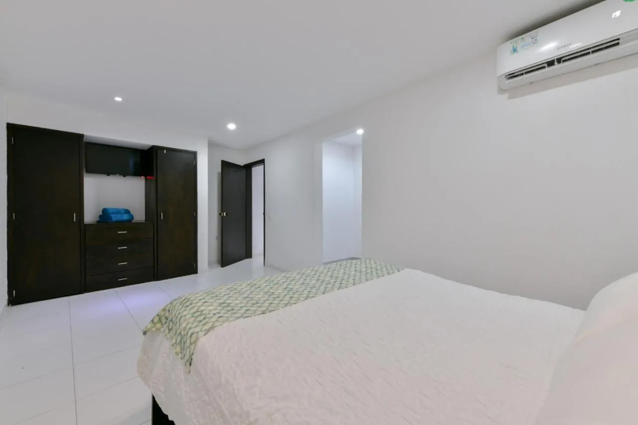 Bed in Tropical Breeze Apartamentos