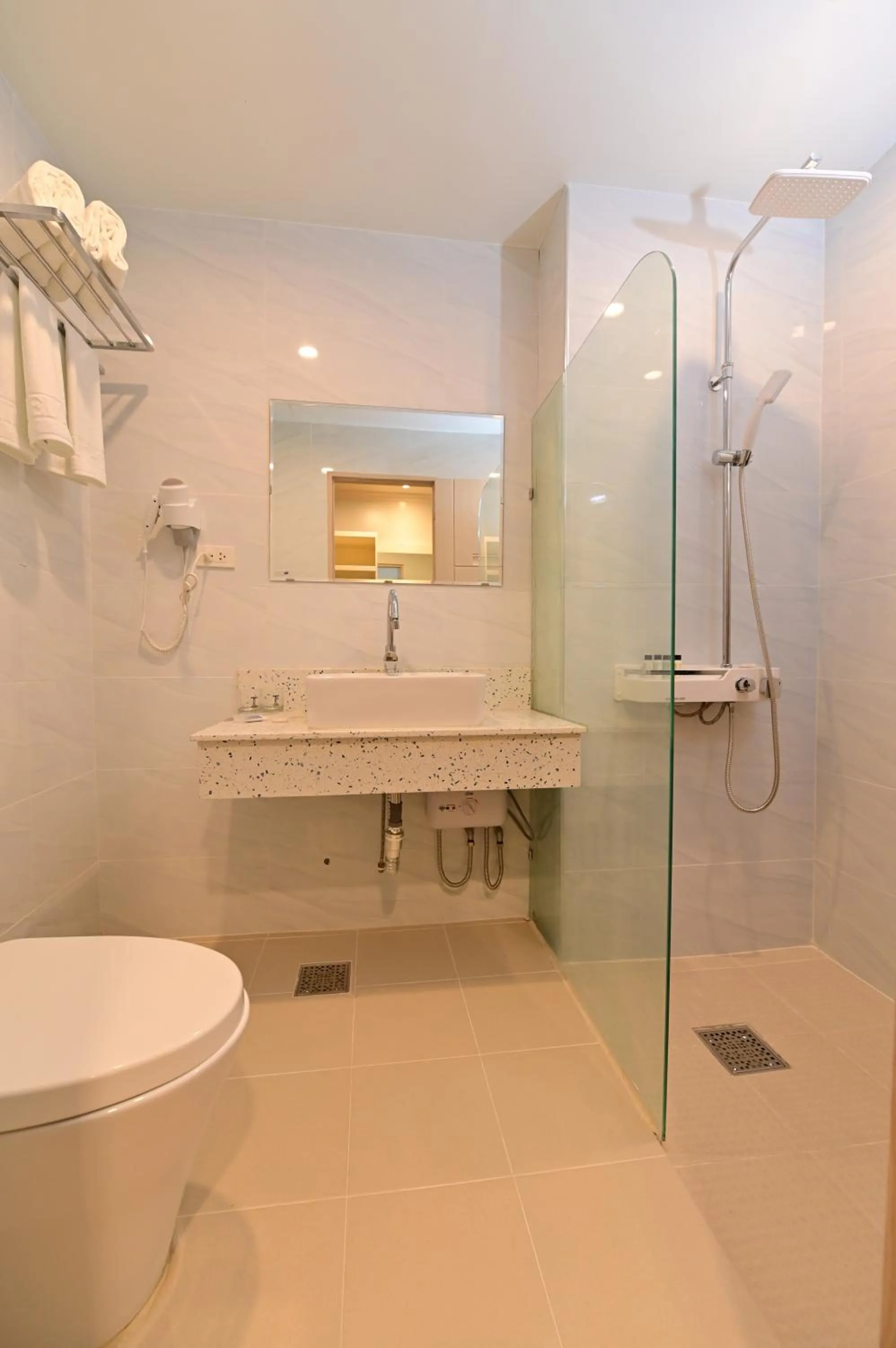 Toilet in T Shine Resort and Spa