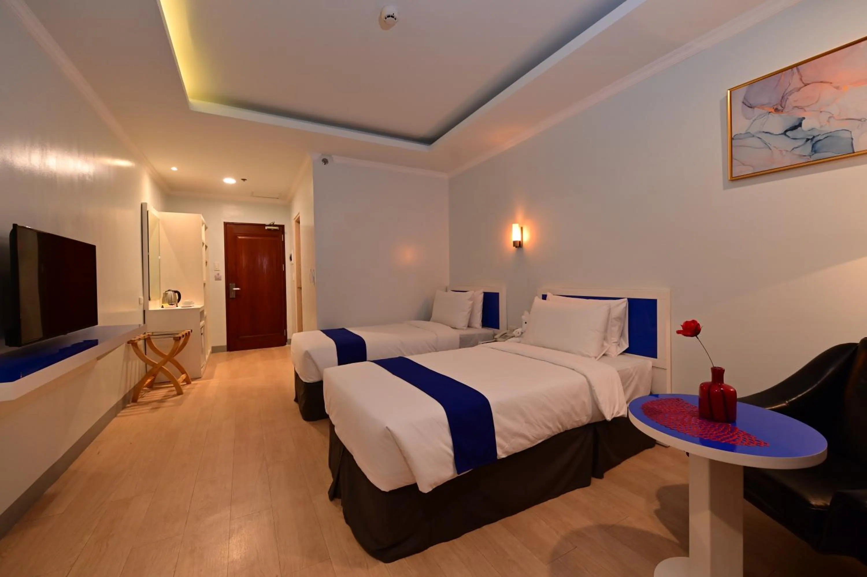 Bed in T Shine Resort and Spa