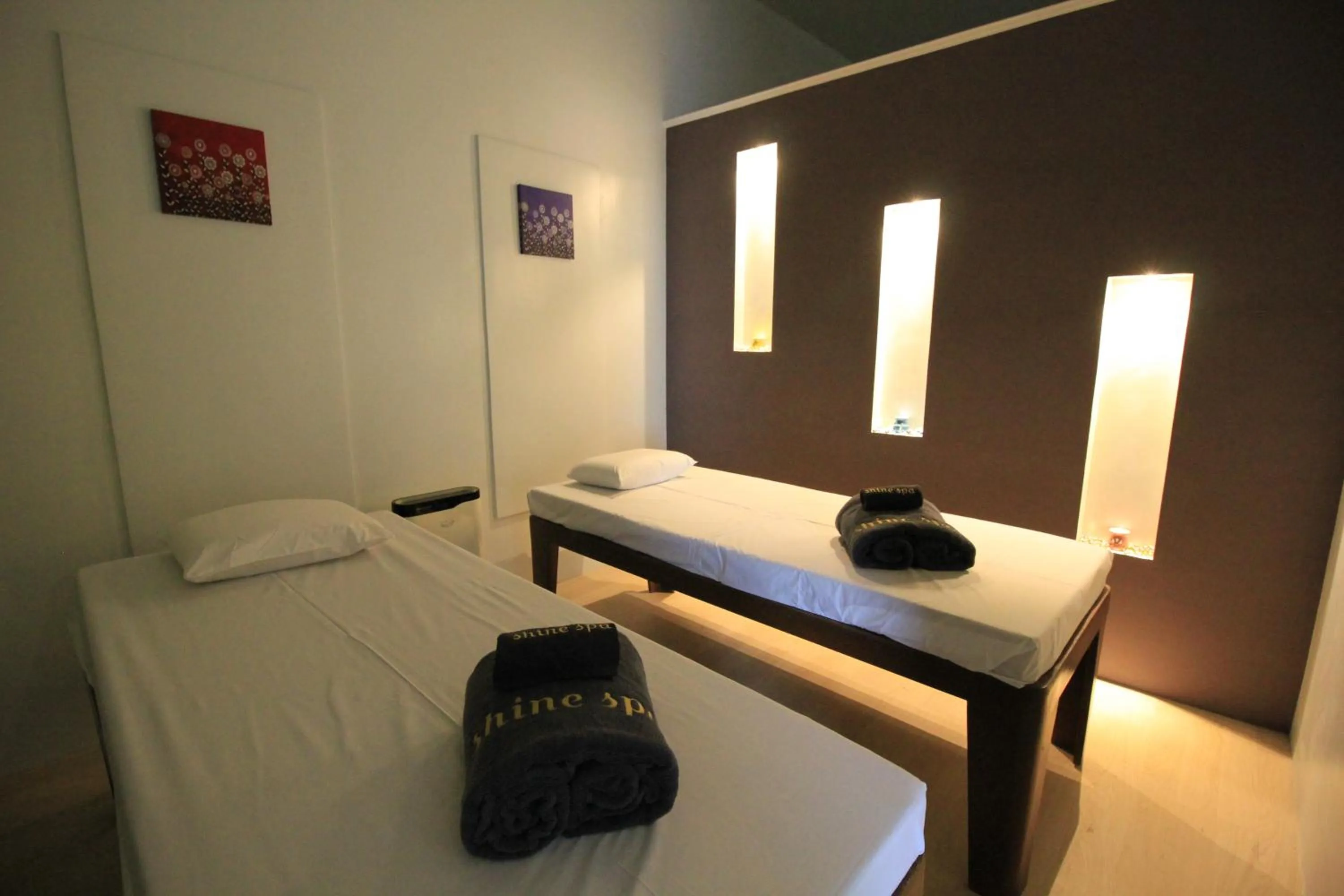 Bed in T Shine Resort and Spa