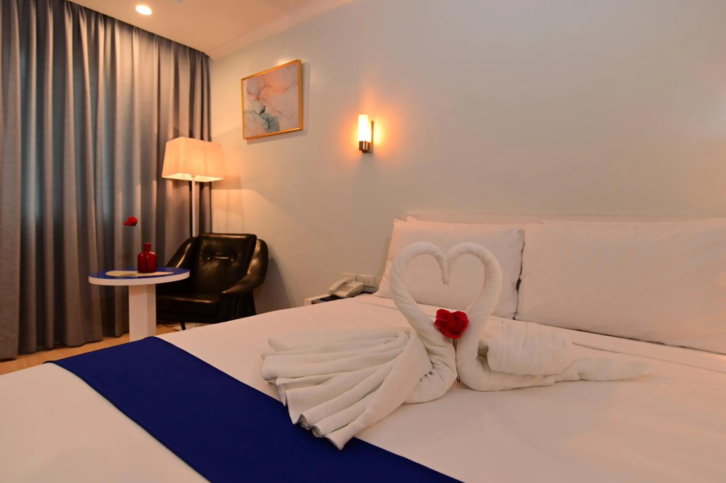 Bed in T Shine Resort and Spa