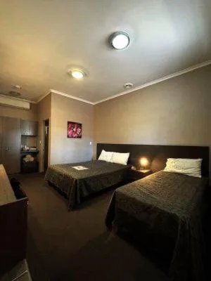 Bed in Bluestone Motor Inn