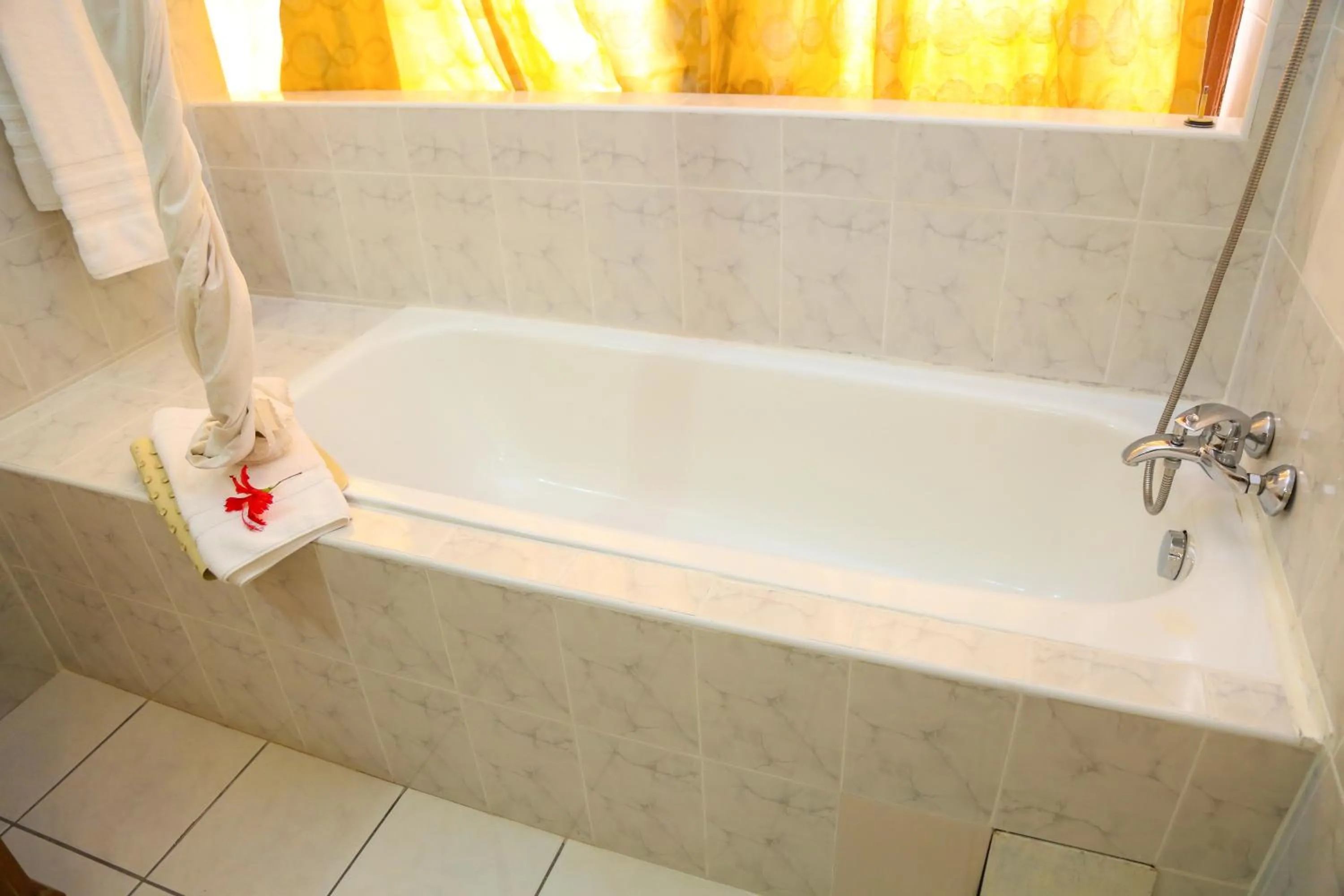 Bathroom in Coconut Grove Regency Hotel