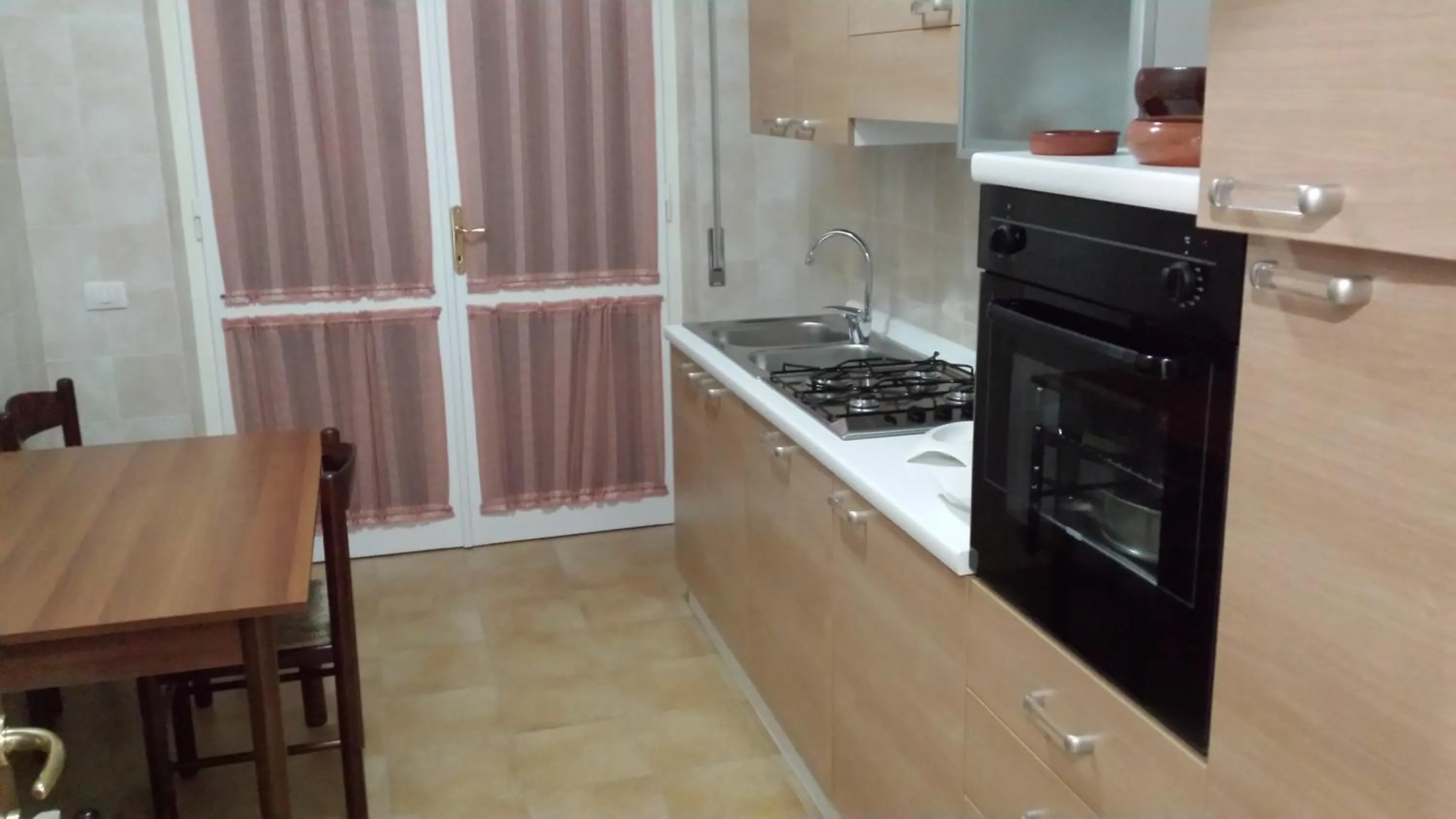 Kitchen or kitchenette in B&B Santa Gilla