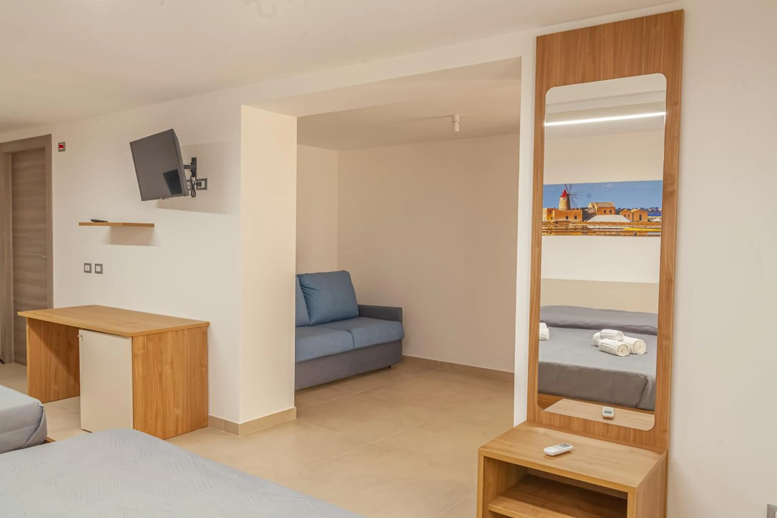 Seating area, Bed in Isgrò Rooms