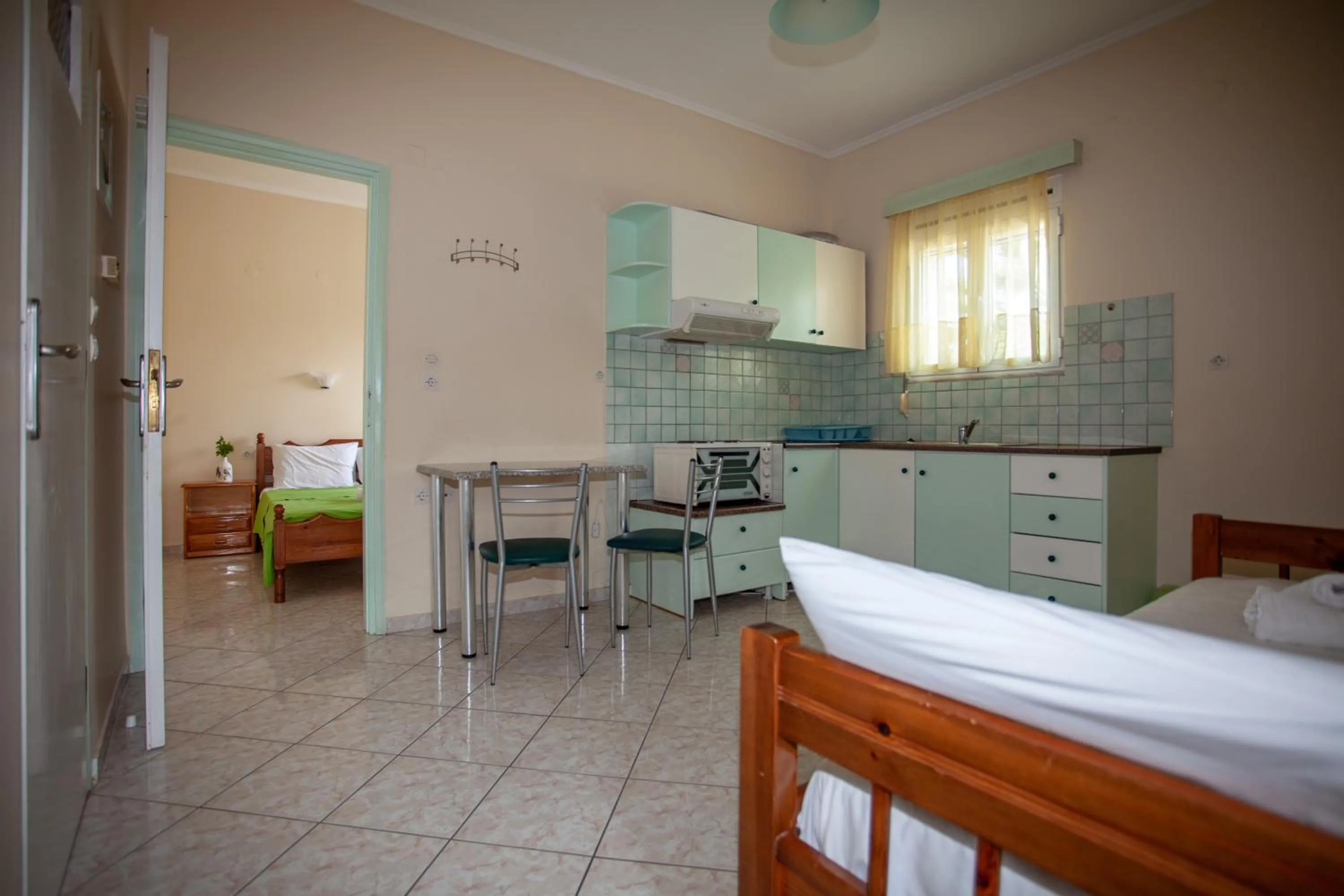 Kitchen or kitchenette, Bed in Eliza Apartments