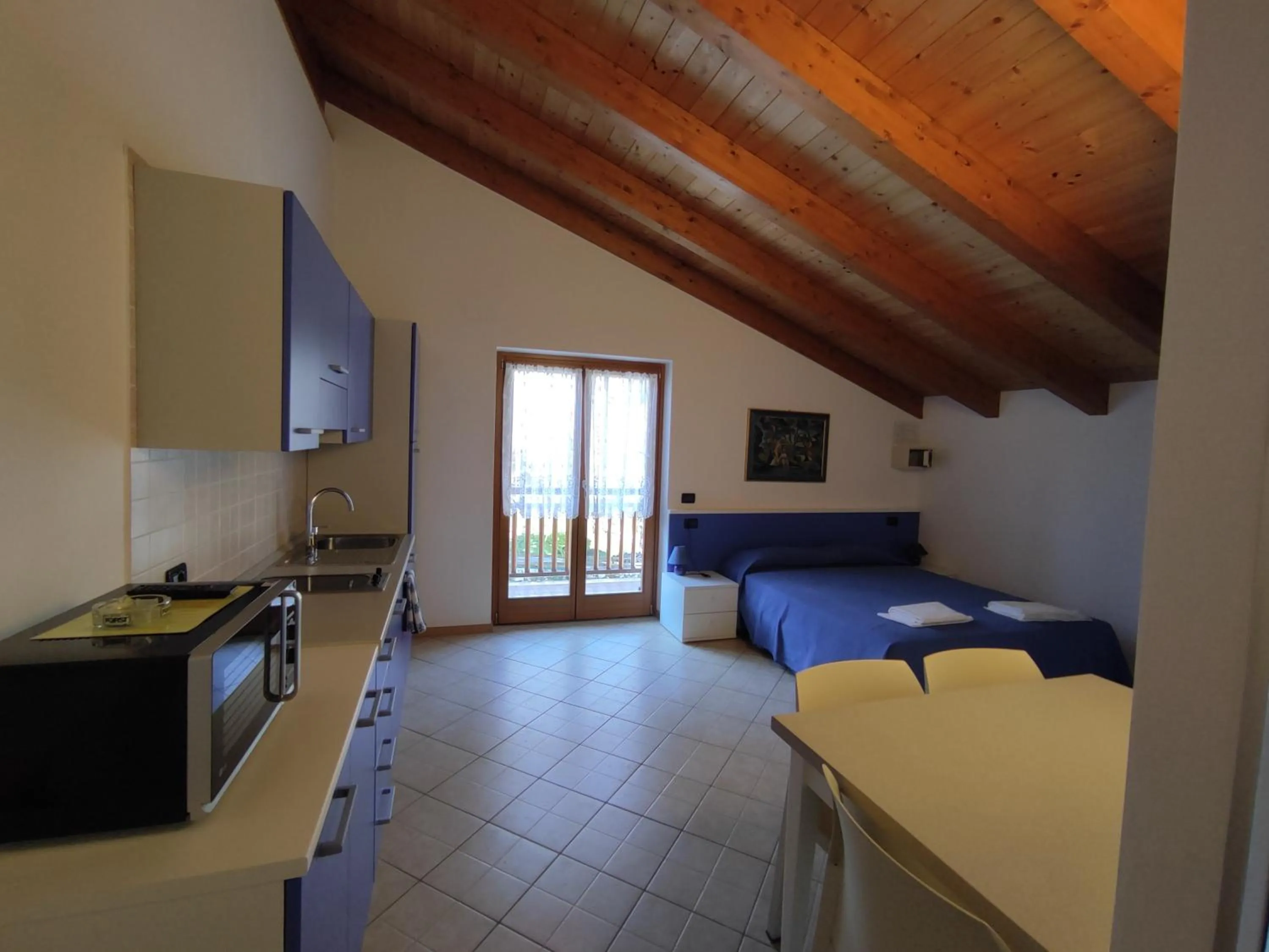 Kitchen or kitchenette, Bed in Residenza Arcobaleno
