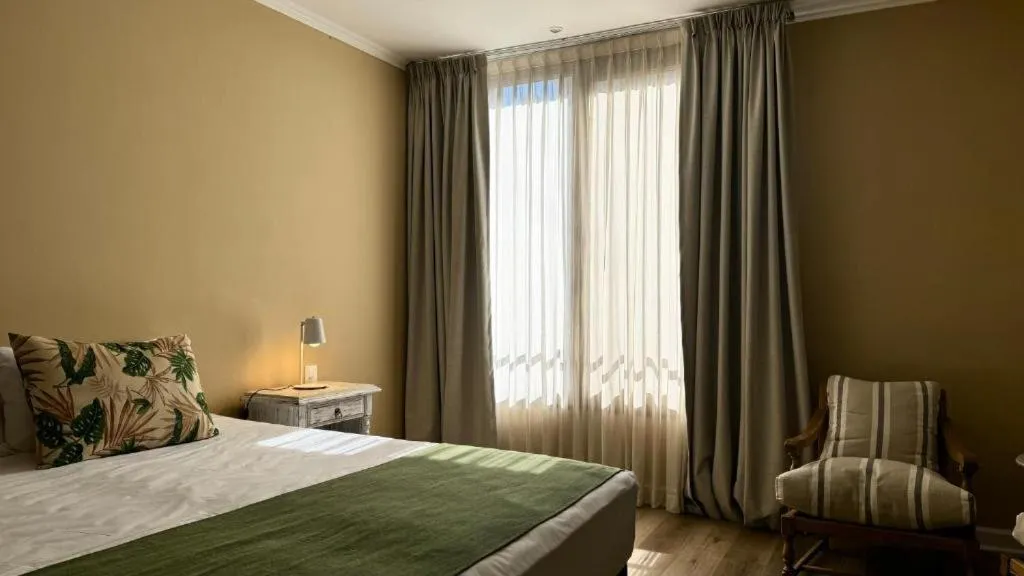 Bed in Gardi Hotel & Suites