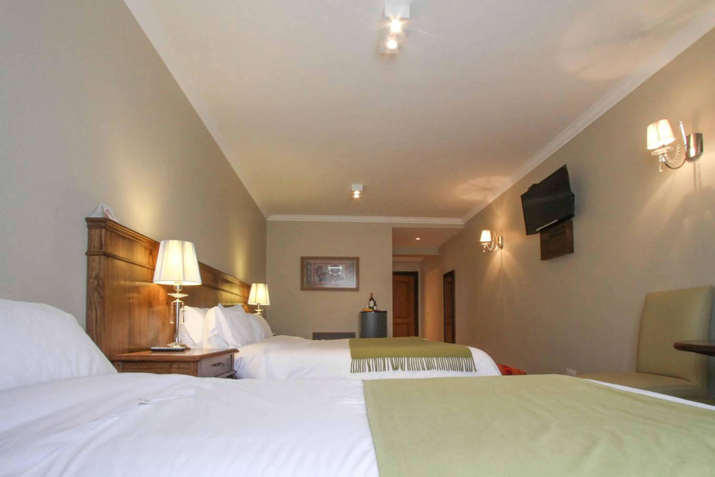 Bed in Chalten Suites Hotel