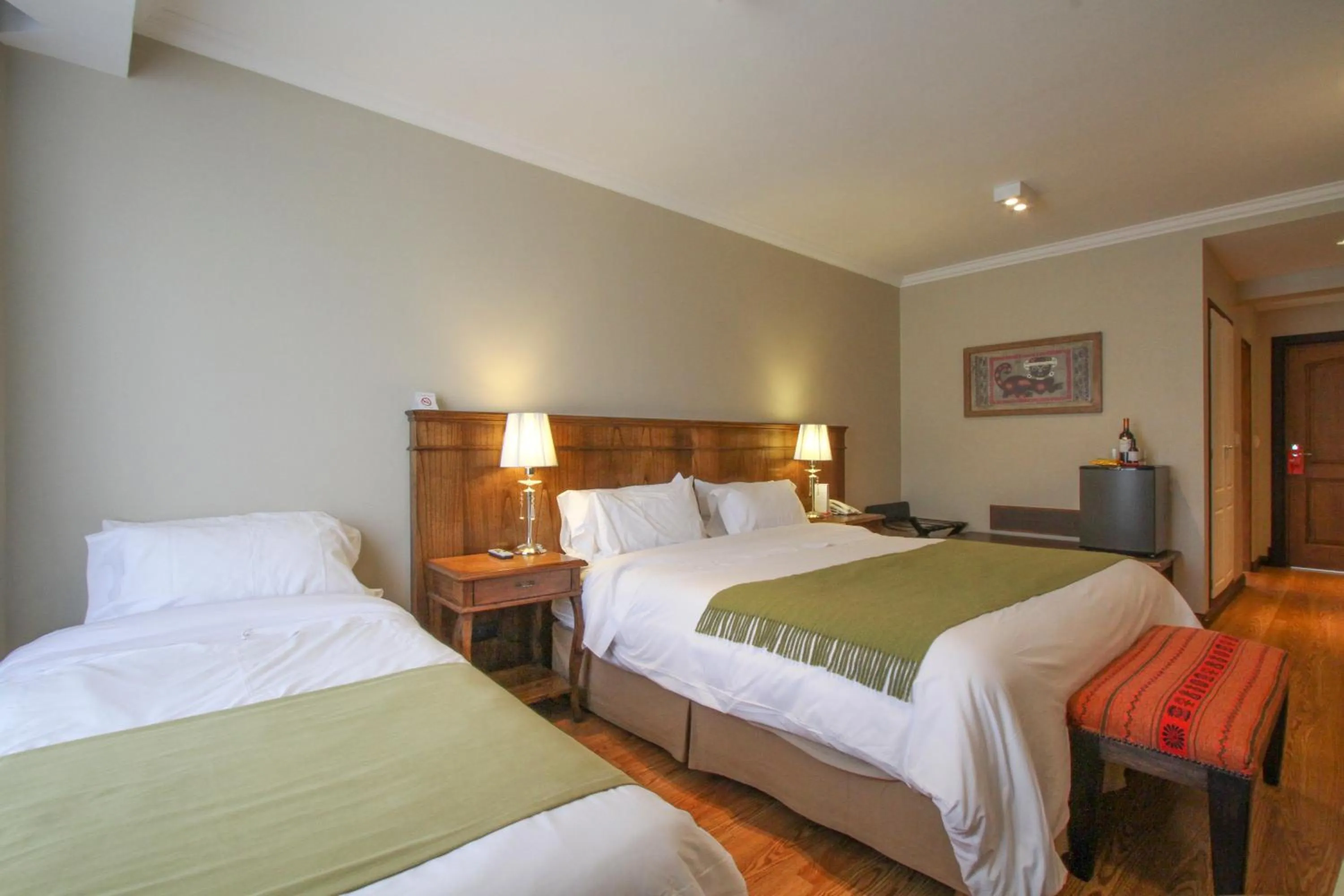 Bed in Chalten Suites Hotel