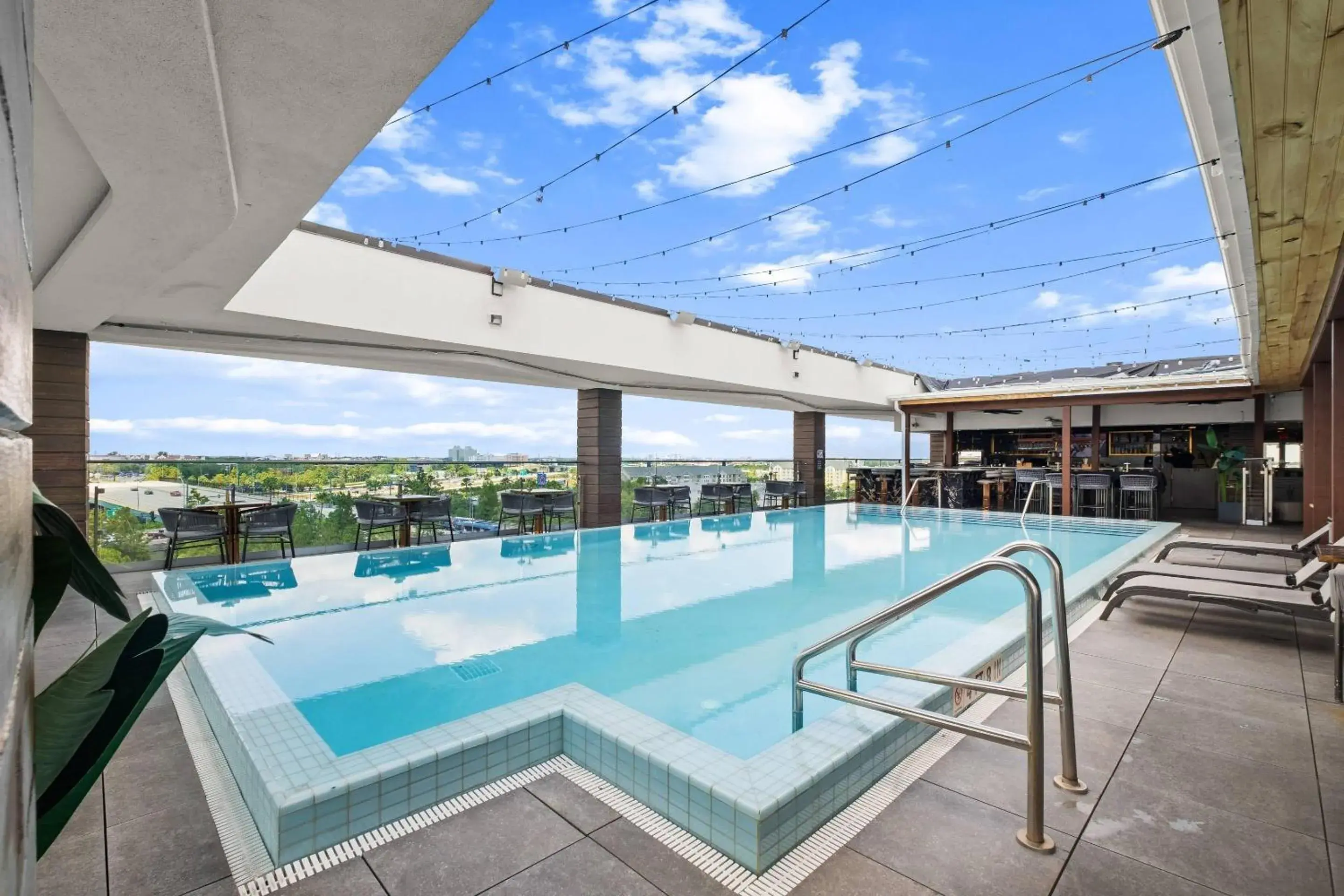 Swimming pool in Cambria Hotel Orlando near Universal Theme Parks Swimming pool in Cambria Hotel Orlando near Universal Theme Parks