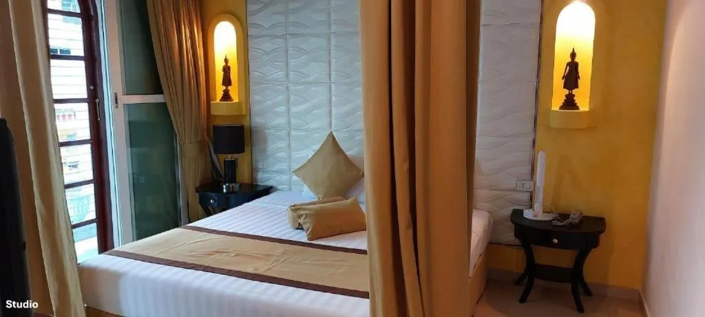 Bed in Poseidon Boutique Hotel