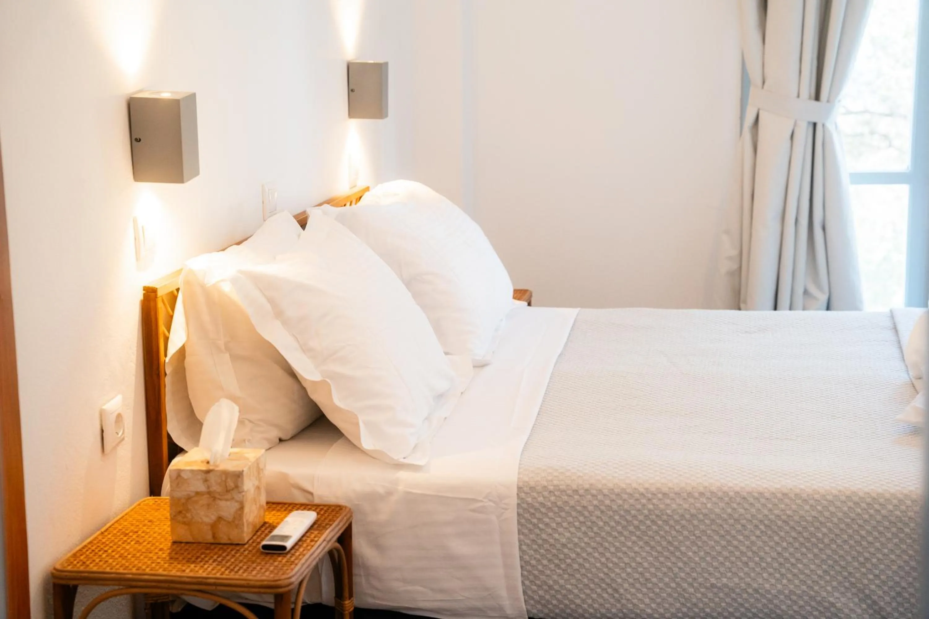 Bed in Divino Suites