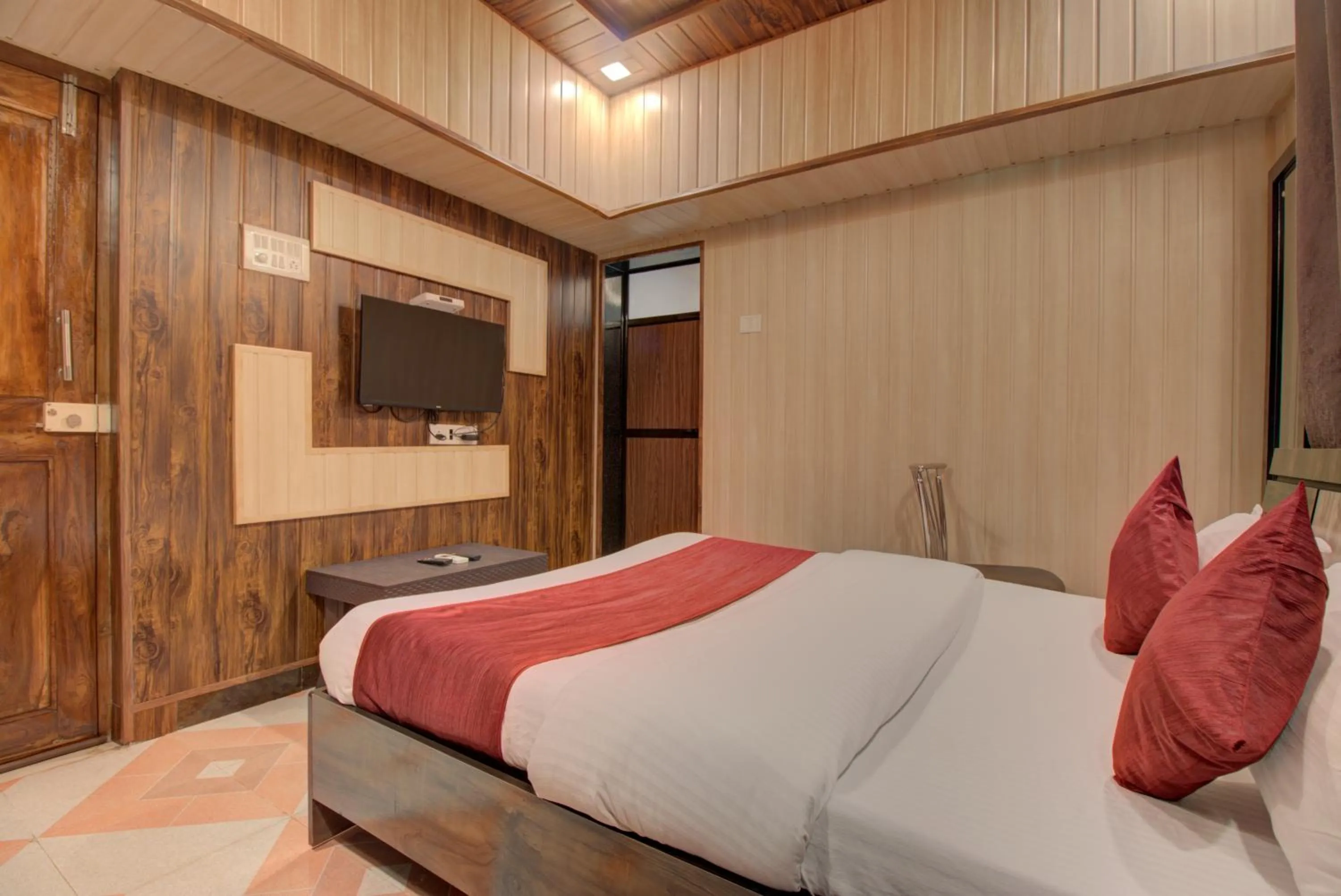 TV and multimedia, Bed in Hotel Snehaprabha - Near to Nagaon Beach Alibaug